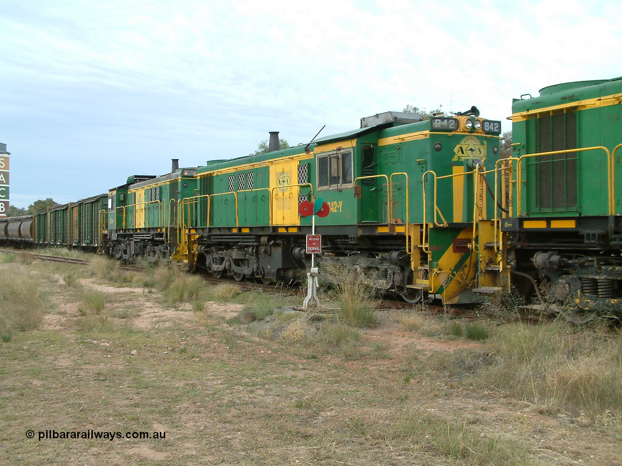 030407 082751
Wudinna, empty grain train shunts back into the grain siding, former Australian National Co-Co locomotives AE Goodwin ALCo model DL531 830 class units 842, serial no. 84140 and 851 serial no. 84137, 851 having been on the Eyre Peninsula since delivered in 1962. 7th April, 2003.
Keywords: 830-class;842;AE-Goodwin;ALCo;DL531;84140;