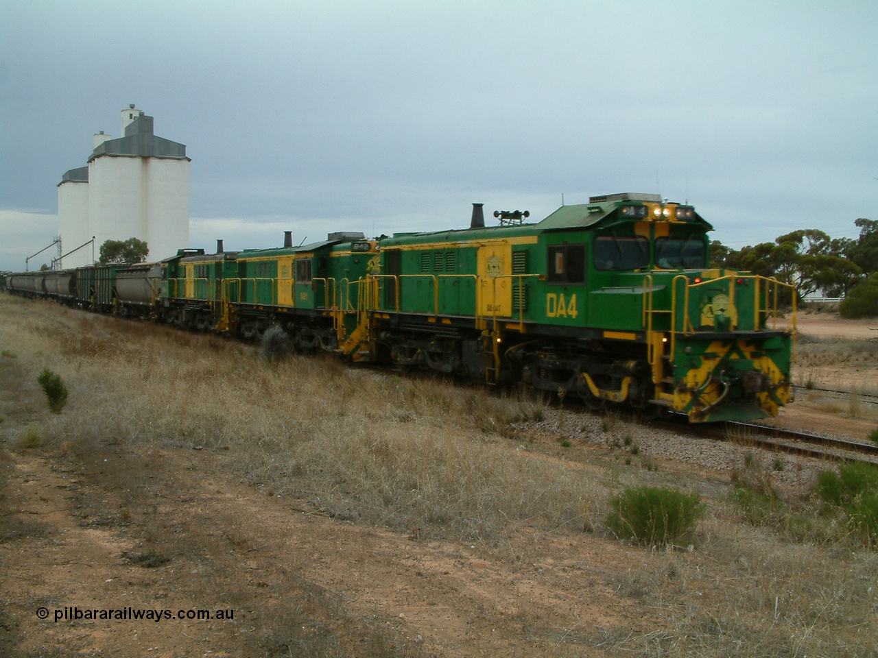 030407 092829
Yaninee, empty grain train behind a trio of former Australian National Co-Co locomotives with rebuilt former AE Goodwin ALCo model DL531 830 class ex 839, serial no. 83730, rebuilt by Port Augusta Workshops to DA class, leading two AE Goodwin ALCo model DL531 830 class units 842, serial no. 84140 and 851 serial no. 84137, 851 having been on the Eyre Peninsula since delivered in 1962, run through express on the mainline. 7th April, 2003.
Keywords: DA-class;DA4;83730;Port-Augusta-WS;ALCo;DL531G/1;830-class;839;rebuild;