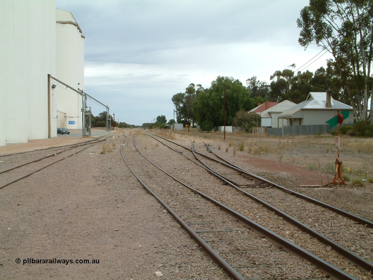 030407 094220
Minnipa, station yard view looking north down No. 3 Road, crossover for grain siding and points for storage roads on the left, points, lever and indicator for No. 1 Road of mainline on the right. 7th April, 2003.
