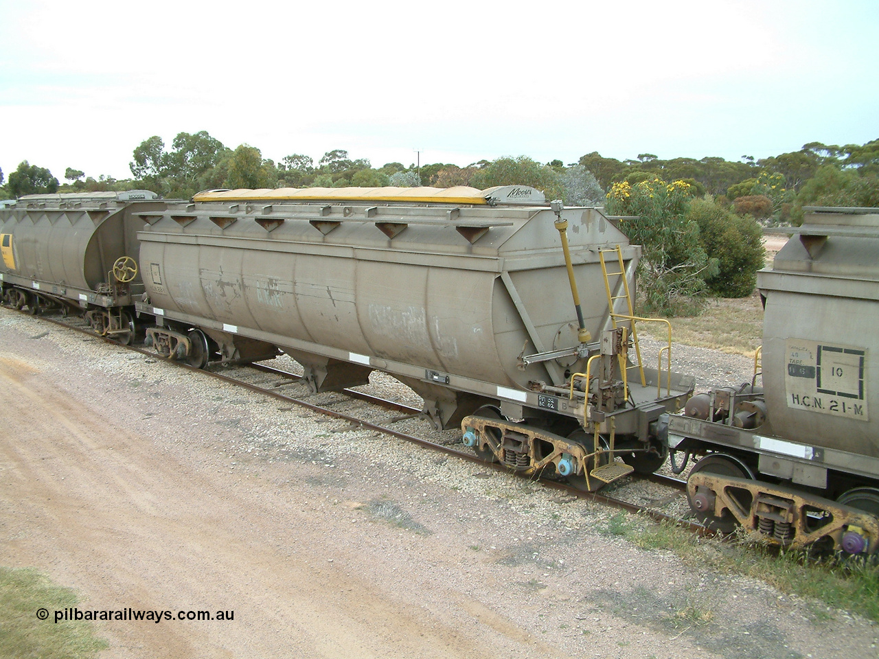 030407 100606
Minnipa, empty grain train bogie grain waggons, HCN type bogie wheat waggon HCN 22 and HCN 21, modified at Islington Workshops in 1978-80 which started life as a Tulloch built NHB type iron ore hopper for the CR on the North Australia Railway in 1968-69 with SAR Islington Workshops built HAN type bogie wheat waggon, HAN 41. 7th April, 2003.
Keywords: HCN-type;HCN22;SAR-Islington-WS;rebuild;Tulloch-Ltd-NSW;NHB-type;NHB1576;