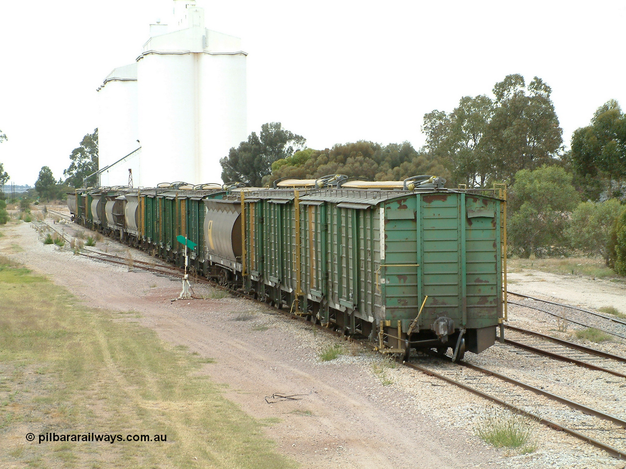 030407 100652
Minnipa, the rear portion left on the mainline as some waggons are shunted into the siding. It consists of 2 ENHV, 1 HAN, 3 ENHV, 1 HAN, 1 HBN, 1 HAN, 1 ENHG, 1 HAN, 1 ENHV, 1 HBN, 1 NHV and 2 HCN class bringing up the rear. 7th April 2003.
Keywords: ENBA-type;ENHV-type;Societe-Gregg-de-Europ;NVD-type;