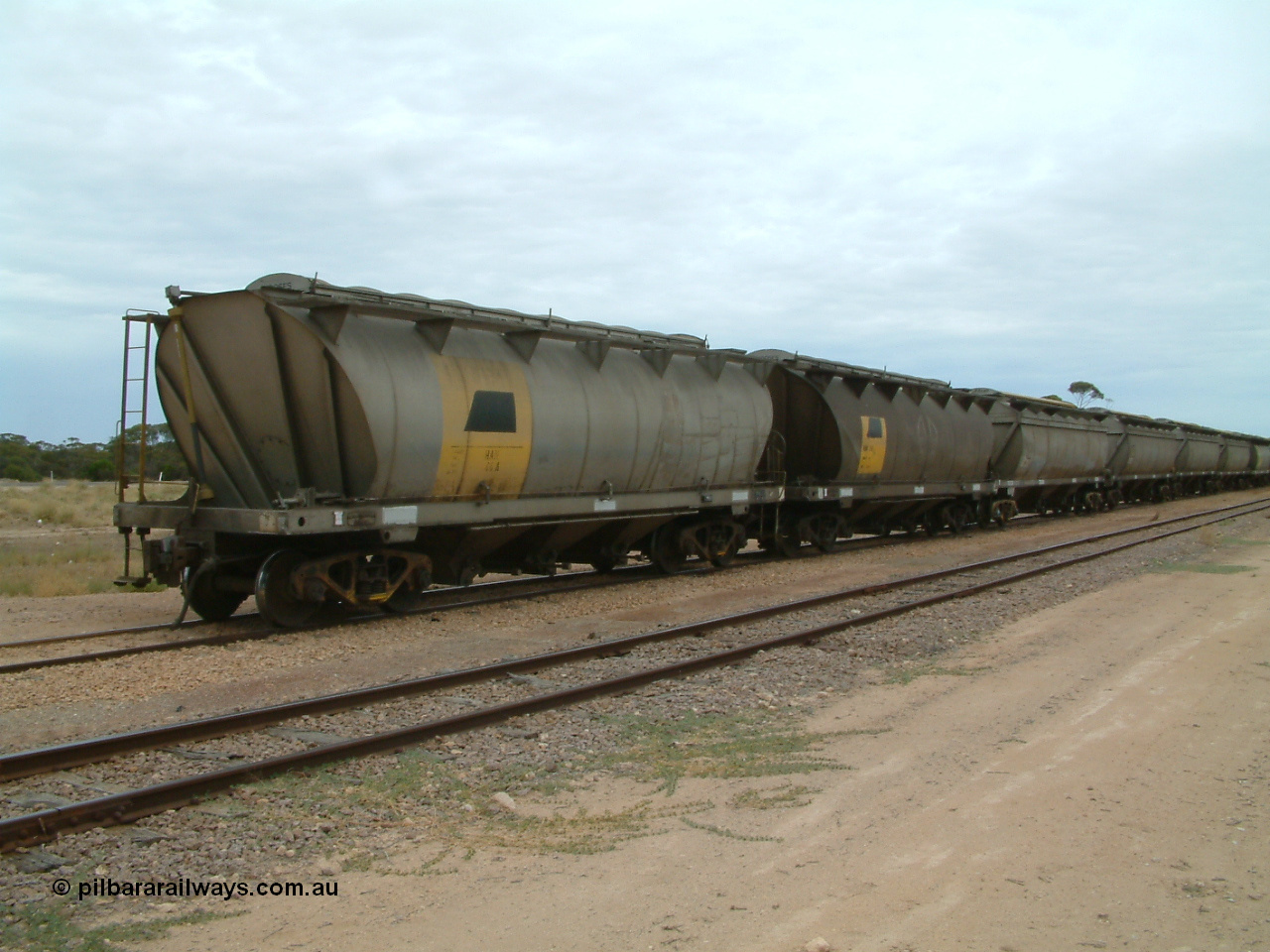 030407 105044
Poochera, loaded SAR Islington Workshops built HAN type bogie wheat waggon HAN 46, at the head of a rake waiting collection. 7th April 2003.
Keywords: HAN-type;HAN46;1969-73/68-46;SAR-Islington-WS;