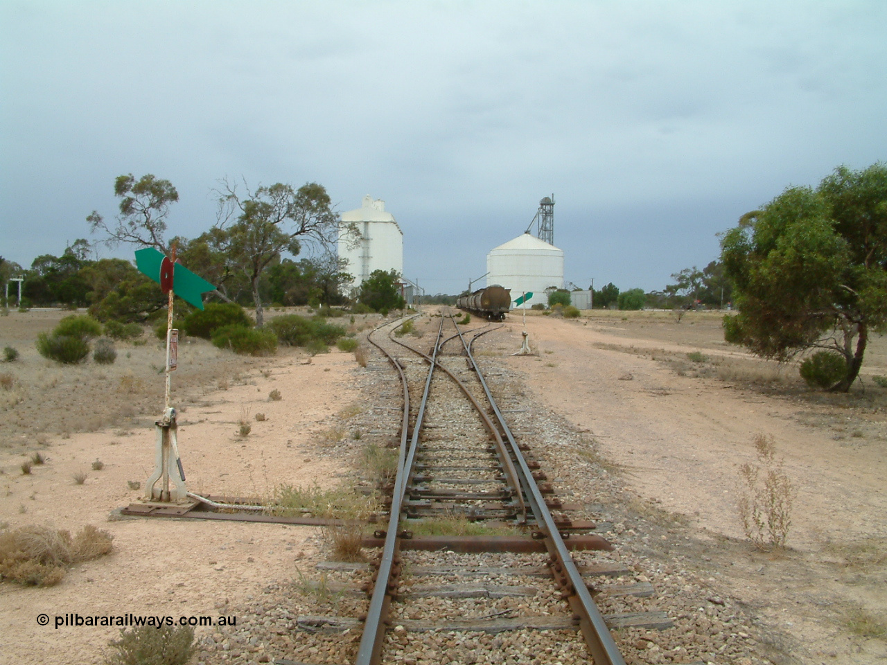 030407 105330
Poochera, yard overview looking south from the north end points, crane and goods shed just visible on the left of the goods siding. 7th April 2003.
