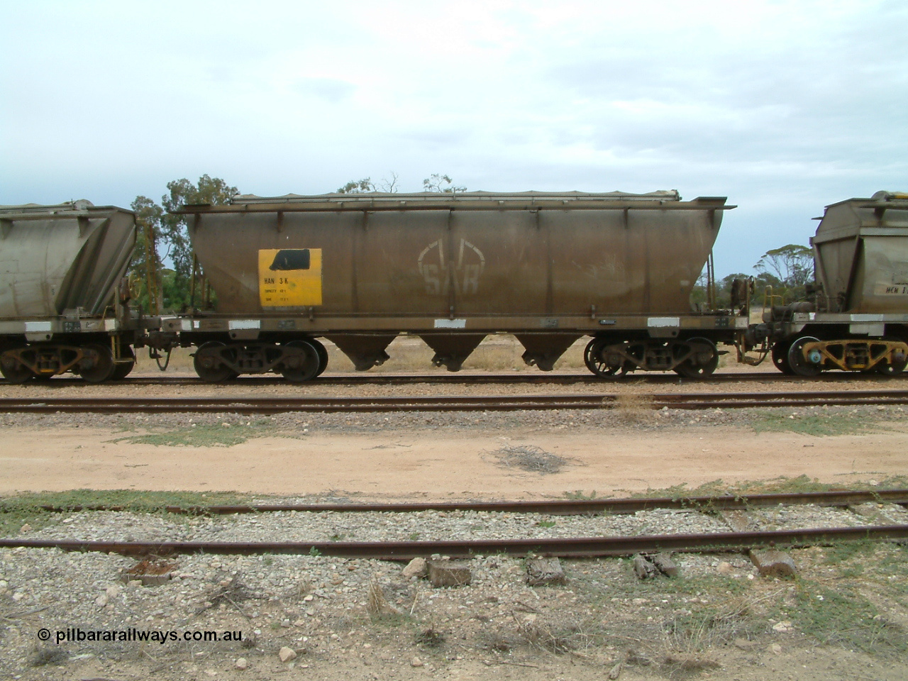 030407 105637
Poochera, track and side view of loaded SAR Islington Workshops built HAN type bogie wheat waggon HAN 3, note spoked wheel on right hand bogie. 7th April 2003.
Keywords: HAN-type;HAN3;1969-73/68-3;SAR-Islington-WS;