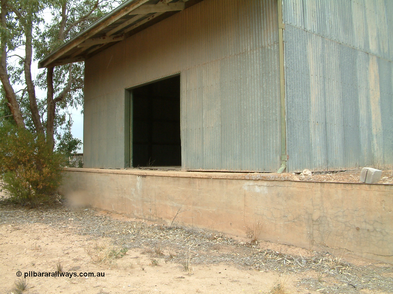 030407 105810
Poochera goods shed road vehicle side with platform and door.
