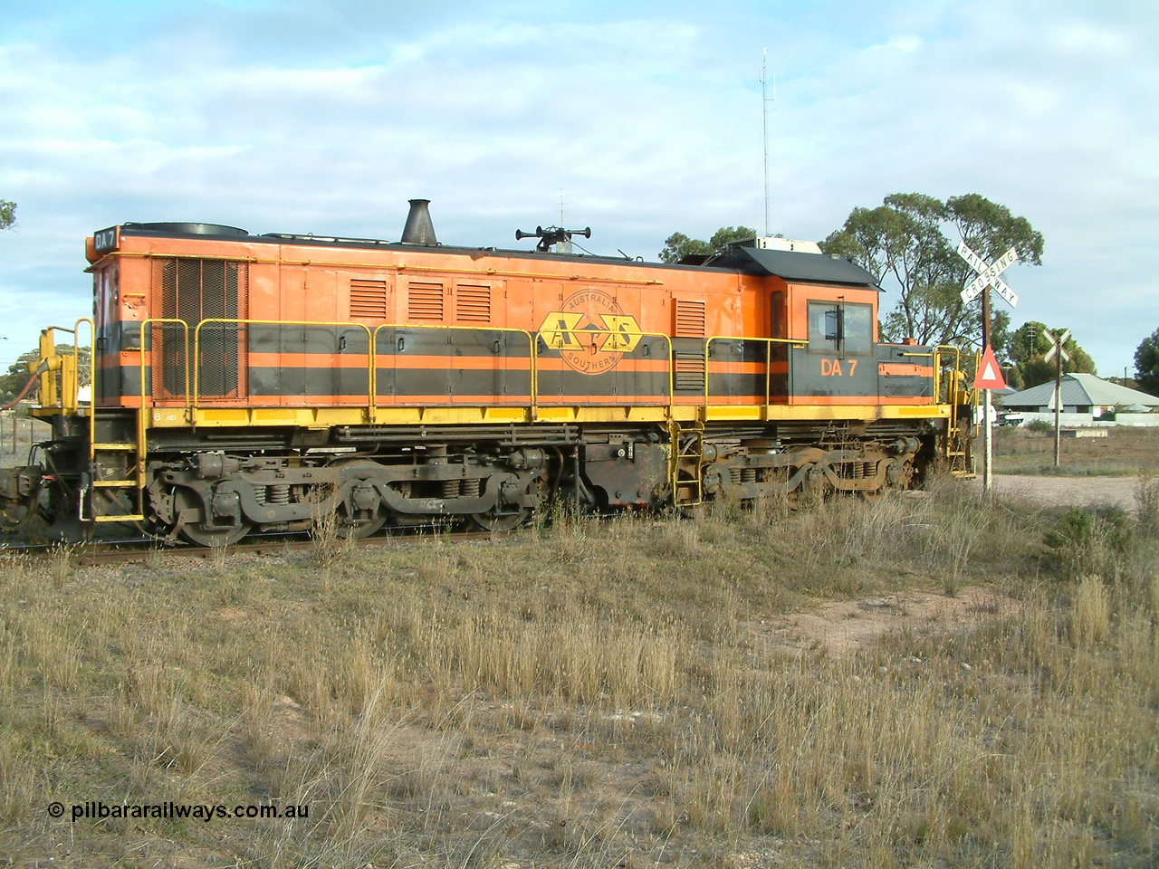 030409 080113
Warramboo, empty grain train stopped for a crew change. Rebuild unit DA 7 in Australian Southern orange and black livery shows its original heritage body style of an NSWGR 48 class 4813 AE Goodwin ALCo model DL531 serial 83713, rebuilt by Islington Workshops SA with long hood and parts from former 830 class 870 AE Goodwin ALCo model DL531 serial G6016-06 in 1998.
Keywords: DA-class;DA7;83713;Port-Augusta-WS;ALCo;DL531G/1;48-class;4813;rebuild;