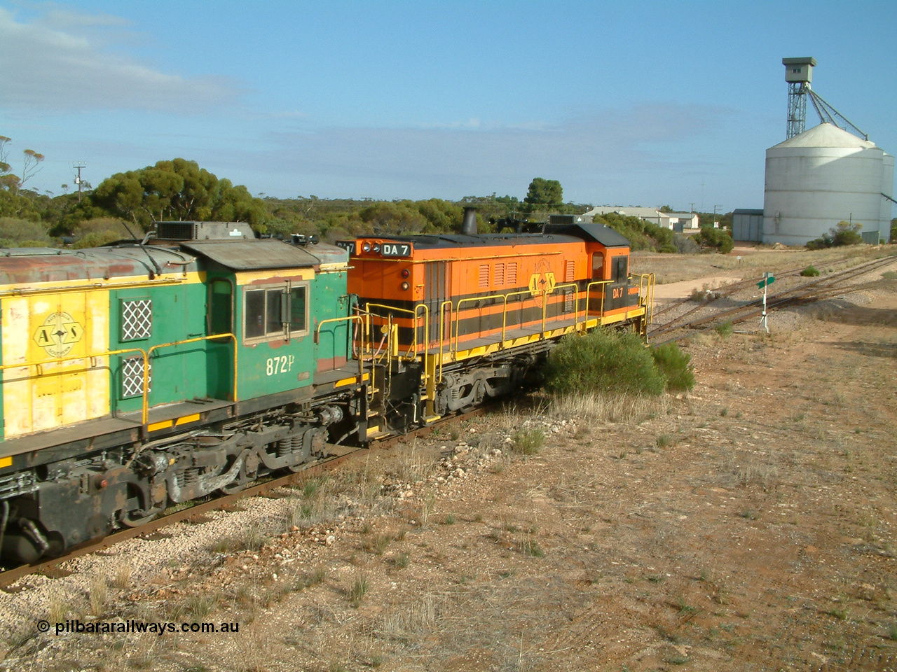 030409 084537
Kyancutta, empty grain train runs through the yard behind rebuild DA class unit DA 7 in Australian Southern orange and black livery leading a pair of AE Goodwin built ALCo model DL531 830 class units 872 and 871 with a string of grain waggons.
Keywords: DA-class;DA7;83713;Port-Augusta-WS;ALCo;DL531G/1;48-class;4813;rebuild;