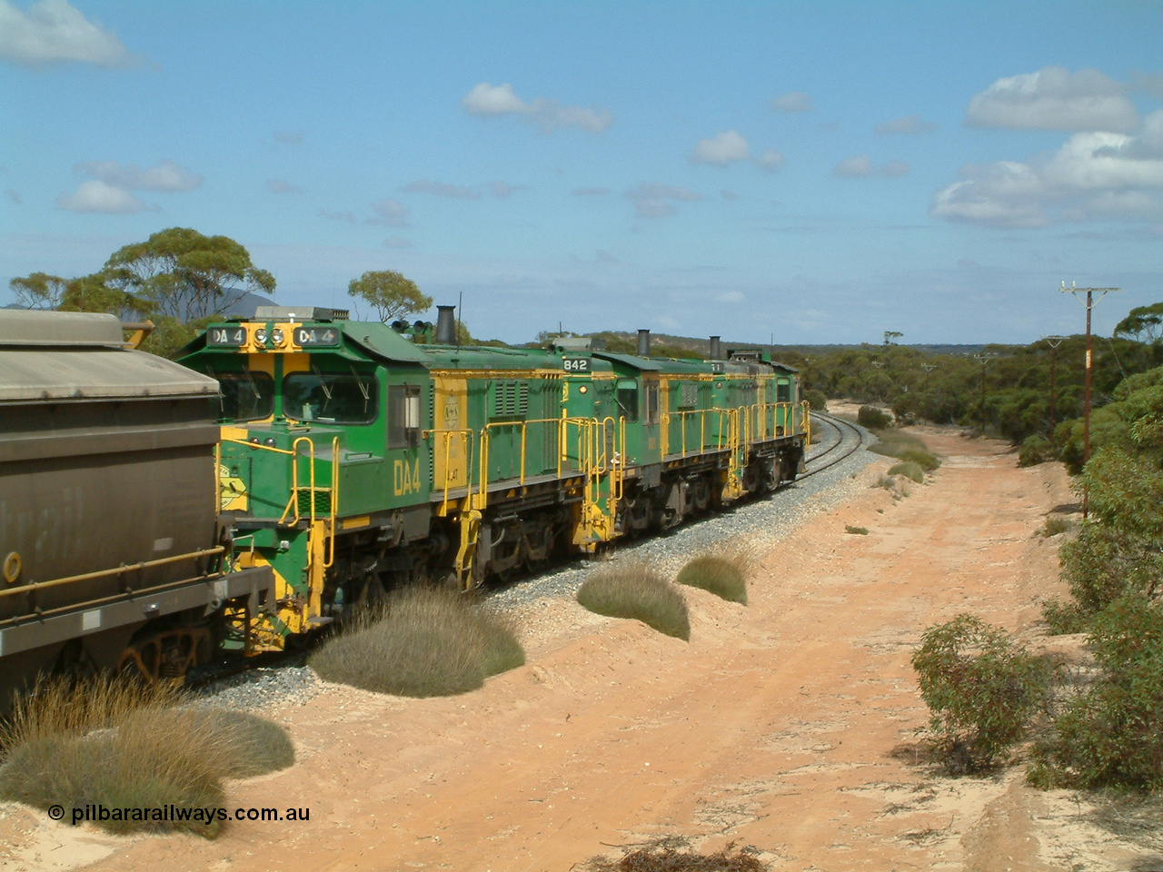 030409 110624
Caralue, loaded grain train working south of the former station site 830 class unit 851 AE Goodwin ALCo model DL531 serial 84137, 851 has spent its entire operating career on the Eyre Peninsula, it leads fellow 830 class 842 serial 84140 and a rebuilt unit DA 4, rebuilt from 830 class unit 839 by Port Augusta Workshops, retains original serial 83730 and model DL531.
Keywords: 830-class;851;AE-Goodwin;ALCo;DL531;84137;