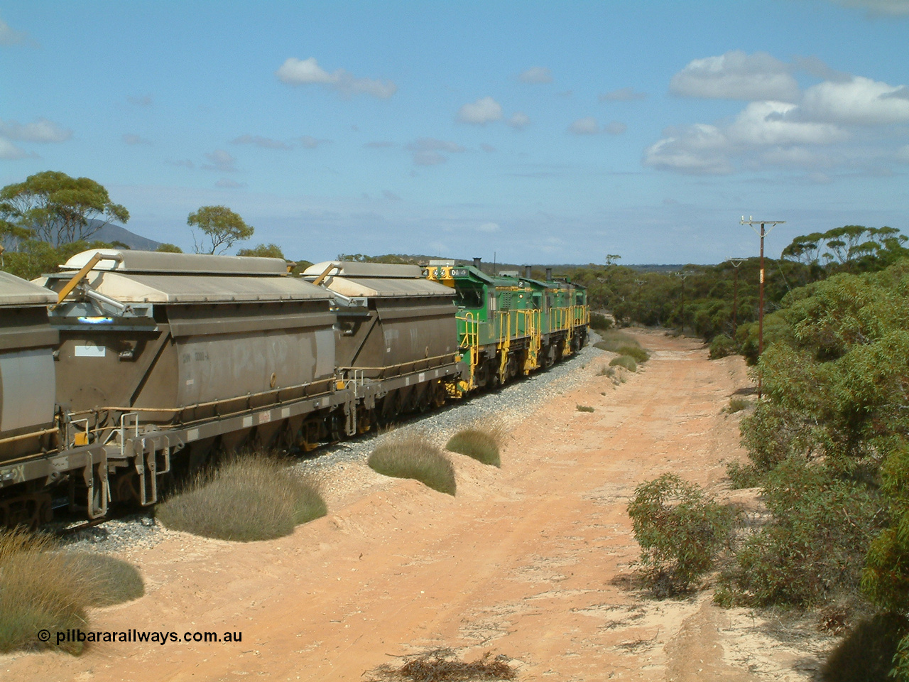030409 110628
Caralue, loaded grain train working south of the former station site 830 class unit 851 AE Goodwin ALCo model DL531 serial 84137, 851 has spent its entire operating career on the Eyre Peninsula, it leads fellow 830 class 842 serial 84140 and a rebuilt unit DA 4, rebuilt from 830 class unit 839 by Port Augusta Workshops, retains original serial 83730 and model DL531.
Keywords: DA-class;DA4;83730;Port-Augusta-WS;ALCo;DL531G/1;830-class;839;rebuild;
