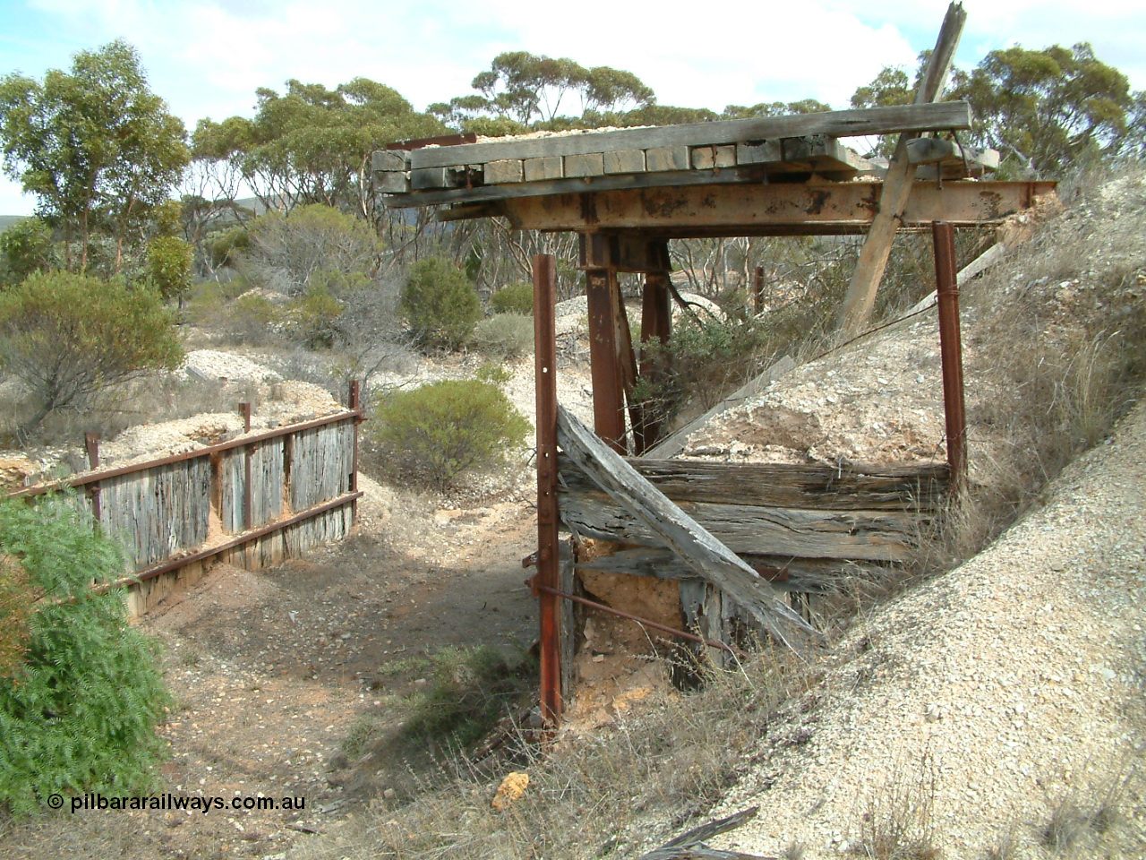 030409 113246
Darke Peake, ballast loading ramp and retaining wall looking west, station site is behind photographer.
