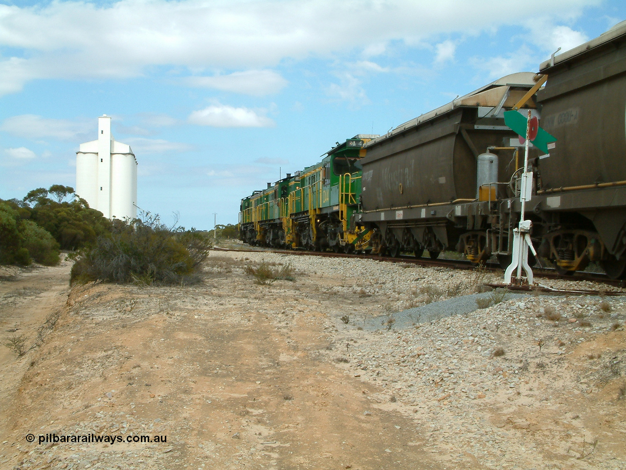 030409 122746
Kielpa, loaded grain train with 830 class unit 851 AE Goodwin ALCo model DL531 serial 84137, 851 has spent its entire operating career on the Eyre Peninsula, leads fellow 830 class 842 serial 84140 and a rebuilt unit DA 4 rumbles over the north end points heading south.
