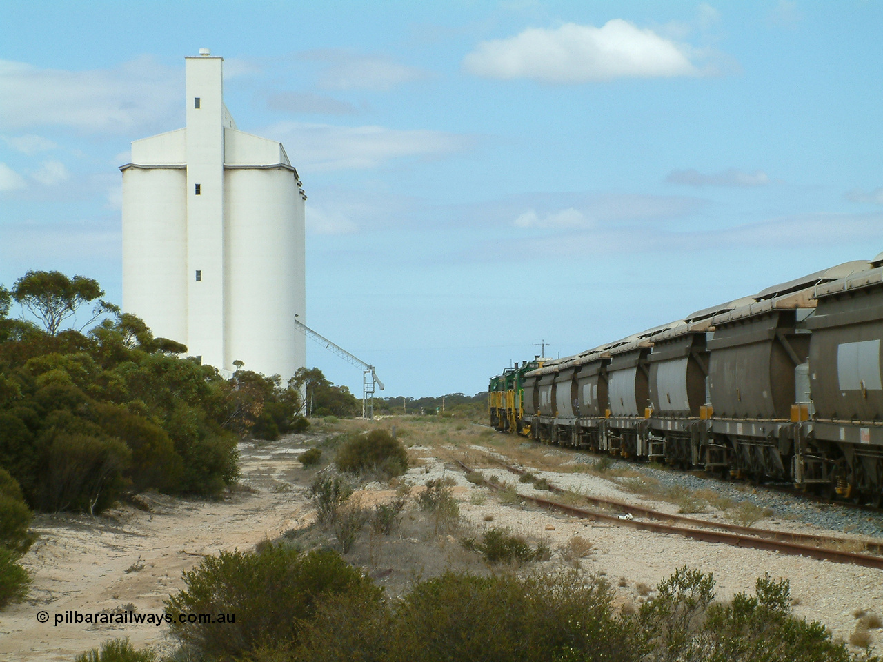 030409 122808
Kielpa, loaded grain train with 830 class unit 851 AE Goodwin ALCo model DL531 serial 84137, 851 has spent its entire operating career on the Eyre Peninsula, leads fellow 830 class 842 serial 84140 and a rebuilt unit DA 4 rumbles over the north end points heading south.
