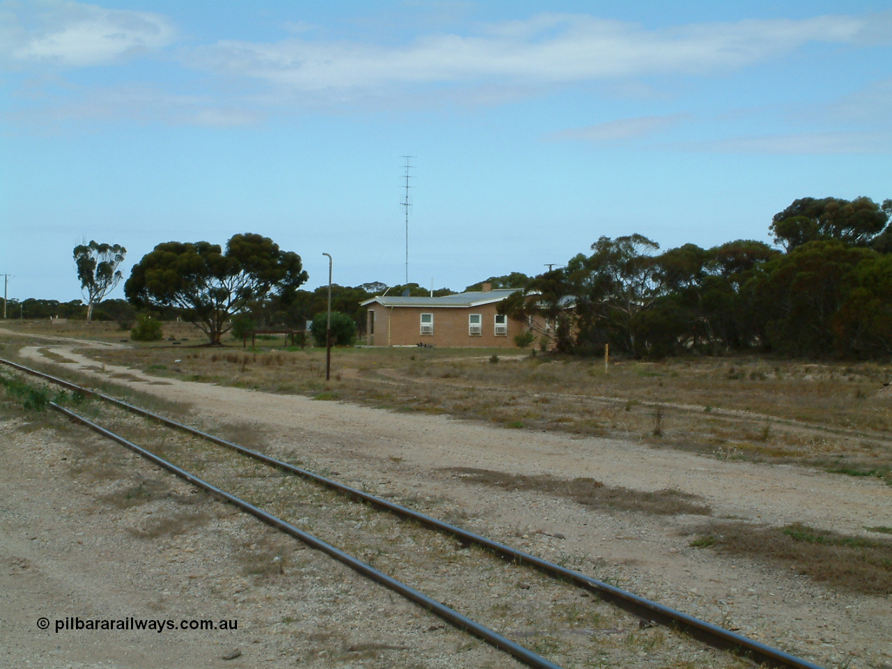 030409 124502
Rudall, view across the mainline looking at the crew barracks built new circa 1960 with the remains of a standpipe, possible for watering ballast.
