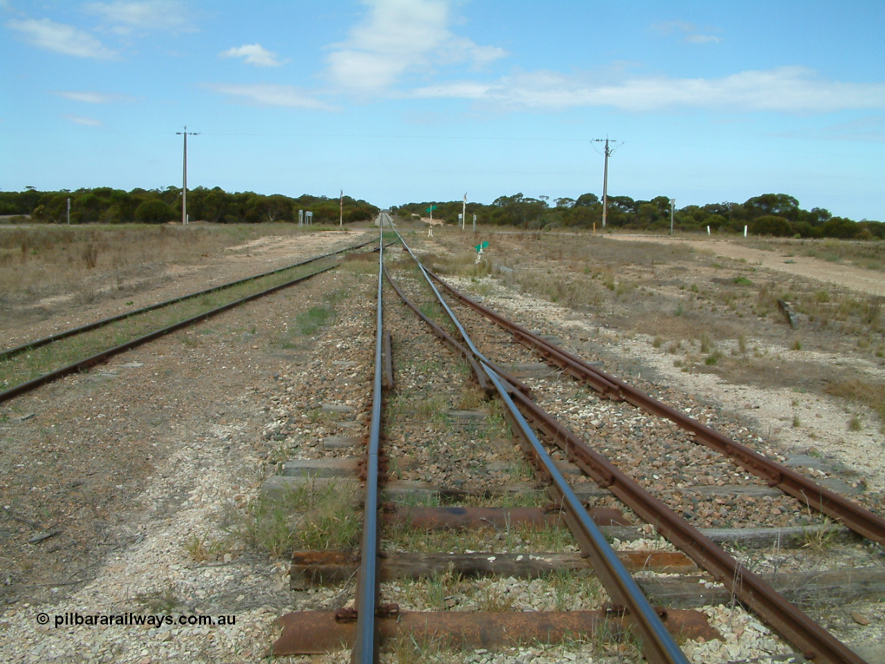 030409 125102
Rudall, view looking south from the south end, the goods and grain loop coming in from the left with the stub siding (former station loop) on the right.
