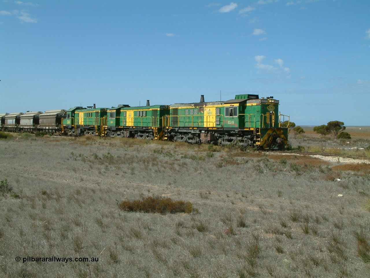 030409 140546
Wharminda, loaded grain train arrives behind 830 class unit 851 AE Goodwin ALCo model DL531 serial 84137, 851 has spent its entire operating career on the Eyre Peninsula, with fellow 830 class 842 serial 84140 and a rebuilt unit DA 4 as they stop to pick up loaded waggons.
Keywords: 830-class;851;AE-Goodwin;ALCo;DL531;84137;