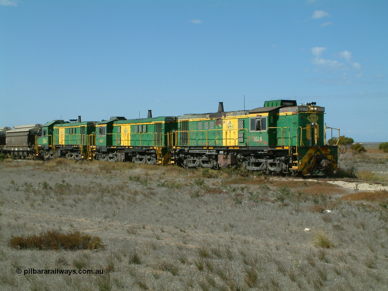 030409 140605
Wharminda, loaded grain train arrives behind 830 class unit 851 AE Goodwin ALCo model DL531 serial 84137, 851 has spent its entire operating career on the Eyre Peninsula, with fellow 830 class 842 serial 84140 and a rebuilt unit DA 4 as they stop to pick up loaded waggons.
Keywords: 830-class;851;AE-Goodwin;ALCo;DL531;84137;