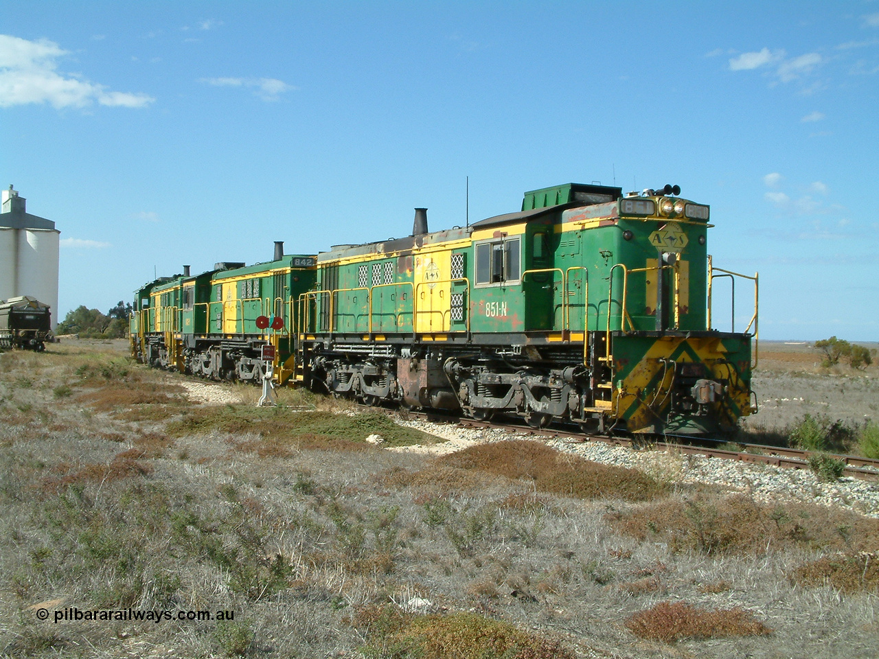 030409 140809
Wharminda, the engines 830 class unit 851 AE Goodwin ALCo model DL531 serial 84137, fellow 830 class 842 serial 84140 and a rebuilt unit DA 4 shunt back into the grain loop to pick up loaded waggons.
Keywords: 830-class;851;AE-Goodwin;ALCo;DL531;84137;