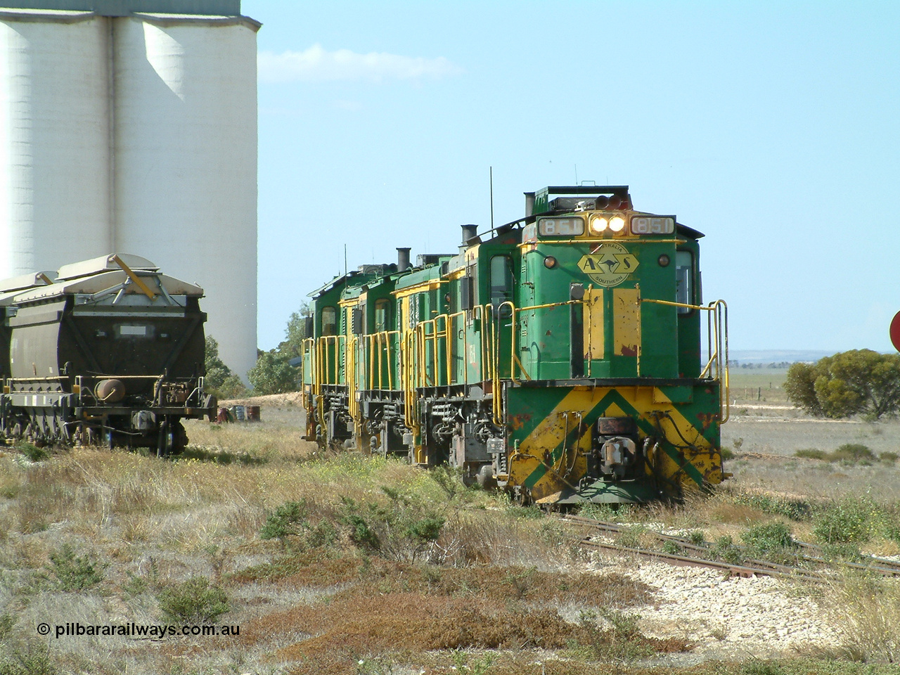 030409 140821
Wharminda, the engines 830 class unit 851 AE Goodwin ALCo model DL531 serial 84137, fellow 830 class 842 serial 84140 and a rebuilt unit DA 4 shunt back into the grain loop to pick up loaded waggons.
Keywords: 830-class;851;AE-Goodwin;ALCo;DL531;84137;