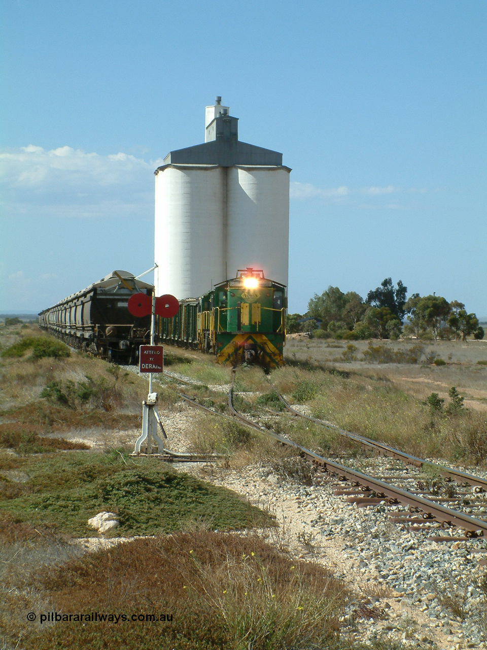 030409 141329
Wharminda, the engines 830 class unit 851 AE Goodwin ALCo model DL531 serial 84137, fellow 830 class 842 serial 84140 and a rebuilt unit DA 4 shunt back out of the siding for the mainline with the loaded waggons.
Keywords: 830-class;851;AE-Goodwin;ALCo;DL531;84137;