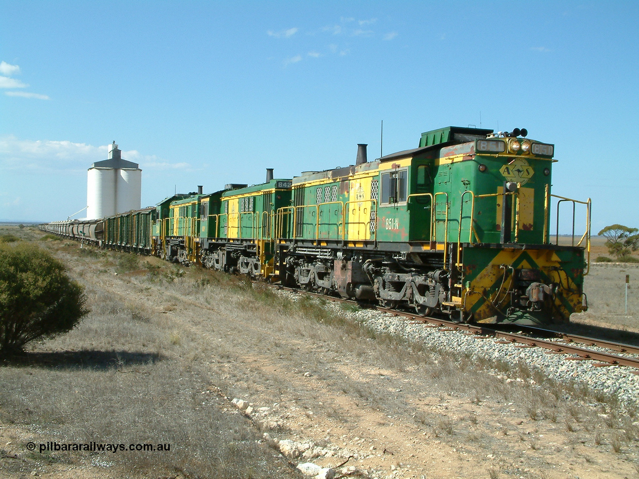 030409 141620
Wharminda, loaded grain train prepares to depart having attached extra loading behind 830 class unit 851 AE Goodwin ALCo model DL531 serial 84137, 851 has spent its entire operating career on the Eyre Peninsula, with fellow 830 class 842 serial 84140 and a rebuilt unit DA 4.
Keywords: 830-class;851;AE-Goodwin;ALCo;DL531;84137;