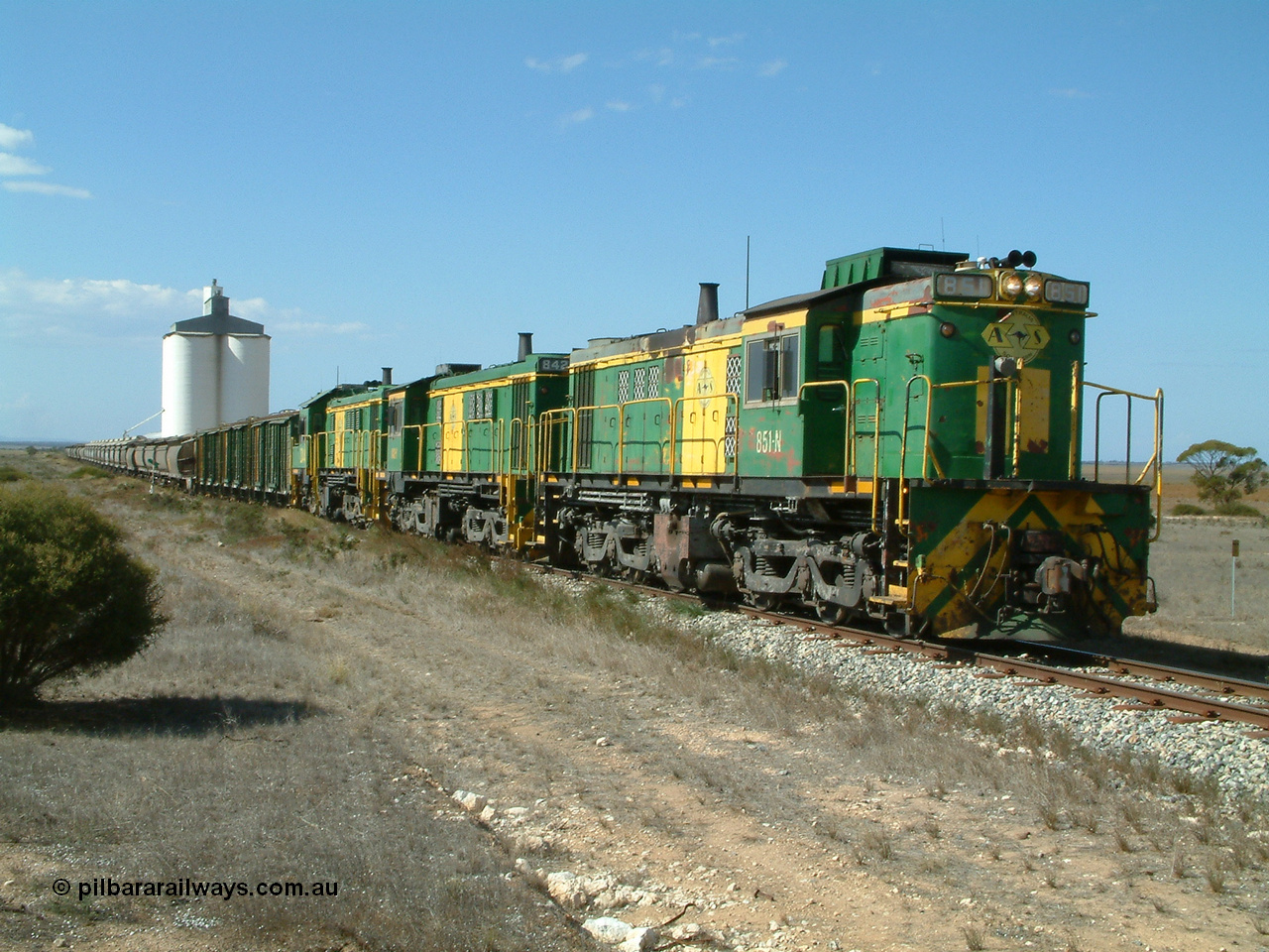 030409 141629
Wharminda, loaded grain train prepares to depart having attached extra loading behind 830 class unit 851 AE Goodwin ALCo model DL531 serial 84137, 851 has spent its entire operating career on the Eyre Peninsula, with fellow 830 class 842 serial 84140 and a rebuilt unit DA 4.
Keywords: 830-class;851;AE-Goodwin;ALCo;DL531;84137;