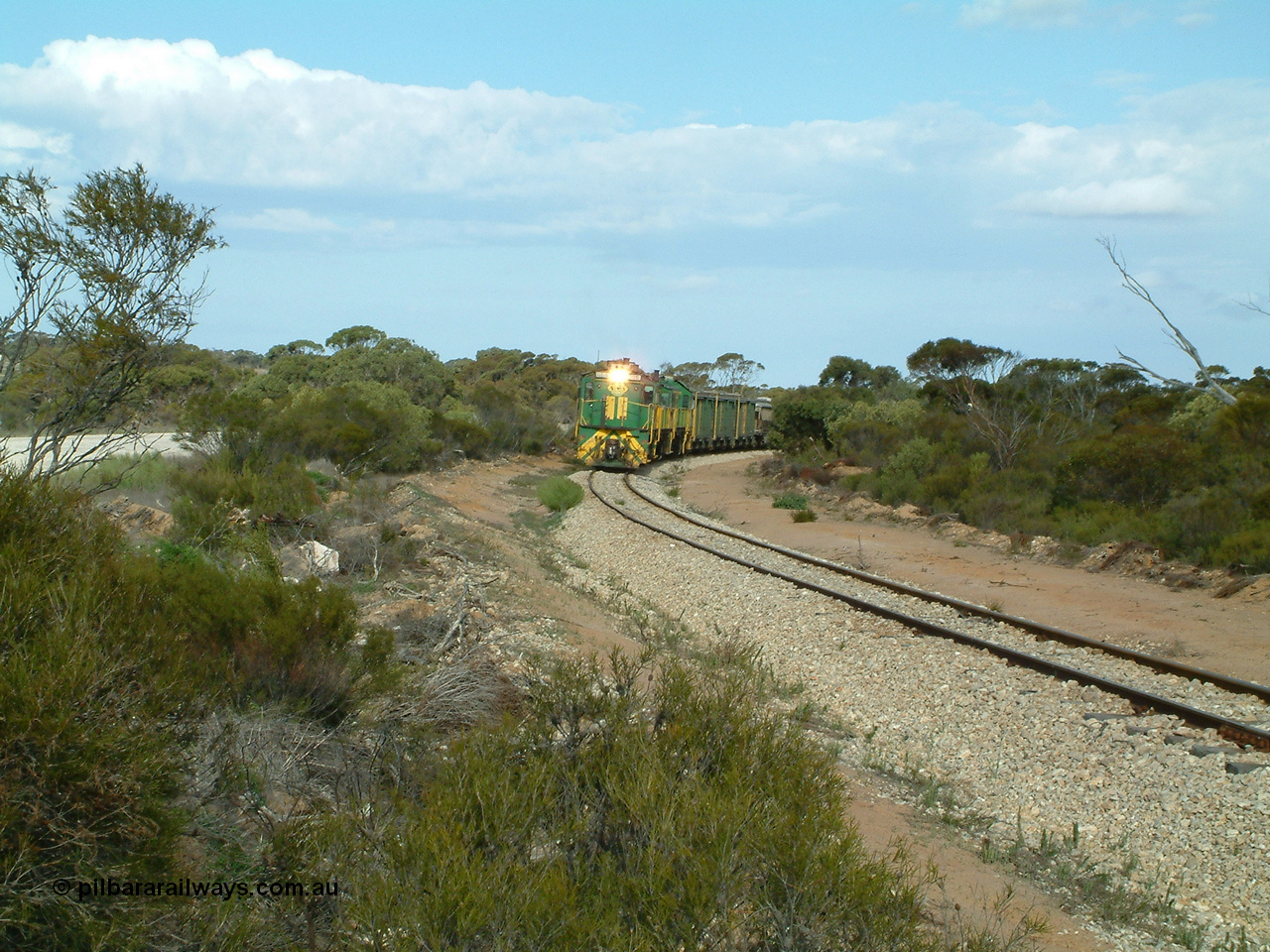 030409 153922
Moody Tank, a loaded grain train storms around the curve behind 830 class unit 851 AE Goodwin ALCo model DL531 serial 84137, fellow 830 class 842 serial 84140 and a rebuilt DA class unit DA 4.
Keywords: 830-class;851;AE-Goodwin;ALCo;DL531;84137;