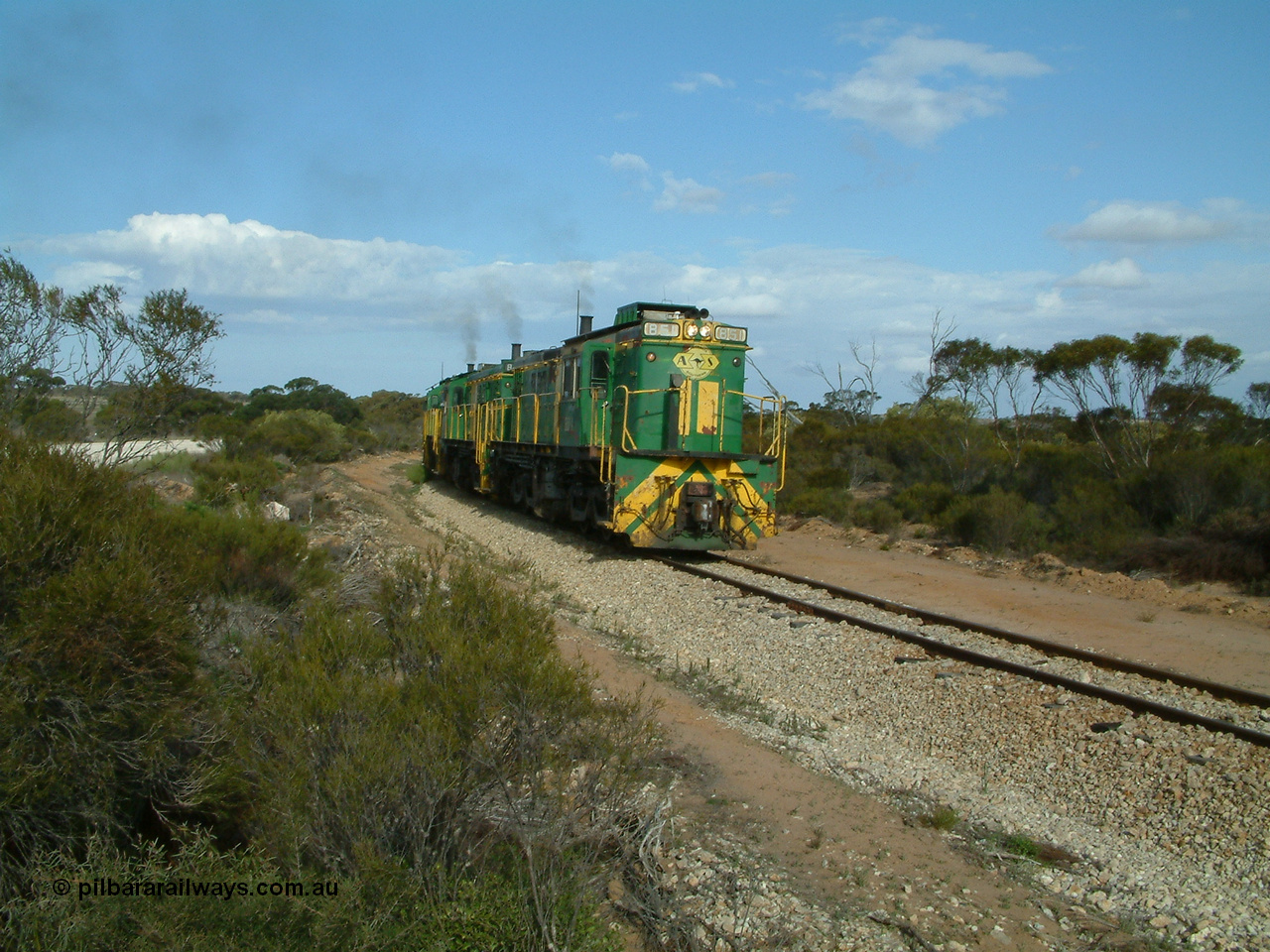 030409 153937
Moody Tank, a loaded grain train storms around the curve behind 830 class unit 851 AE Goodwin ALCo model DL531 serial 84137, fellow 830 class 842 serial 84140 and a rebuilt DA class unit DA 4.
Keywords: 830-class;851;AE-Goodwin;ALCo;DL531;84137;