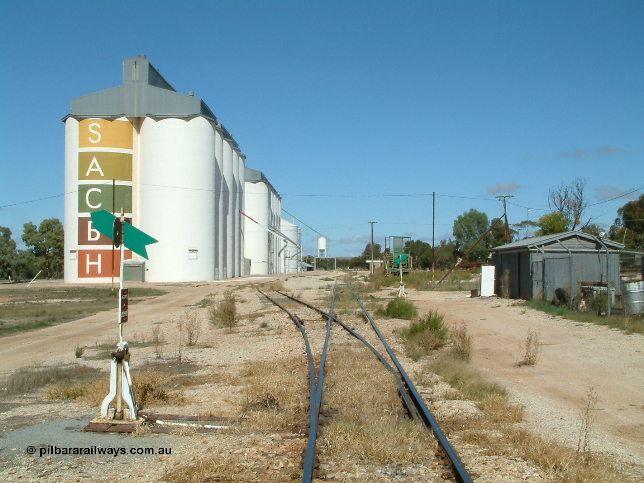 030411 105754
Kimba, station yard view looking south from Kimba Terrace, gang shed on the right, winch waggon visible and silos on the left.
