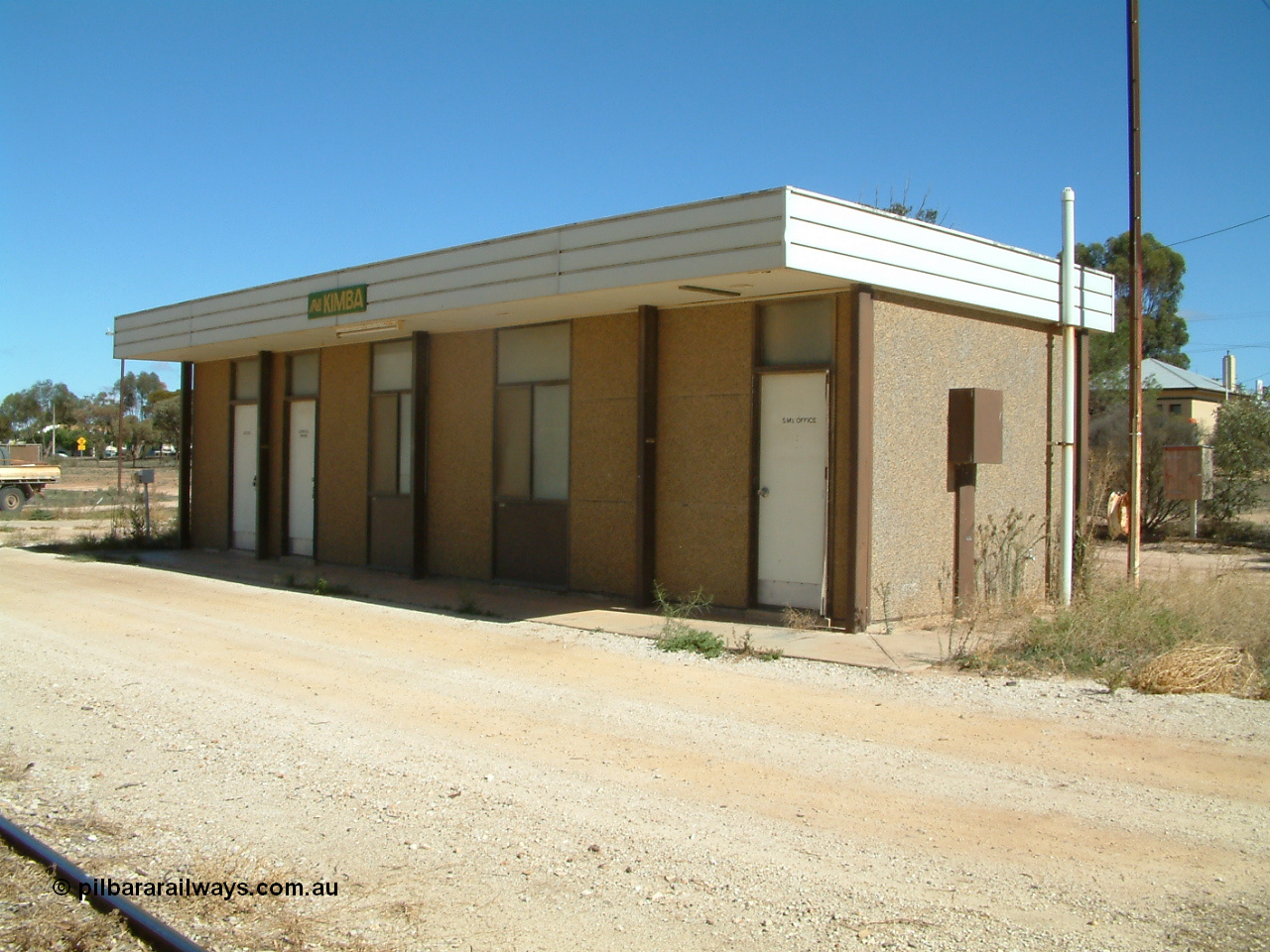 030411 110544
Kimba, station building with AN station sign, modern concrete pre-fab building style.
