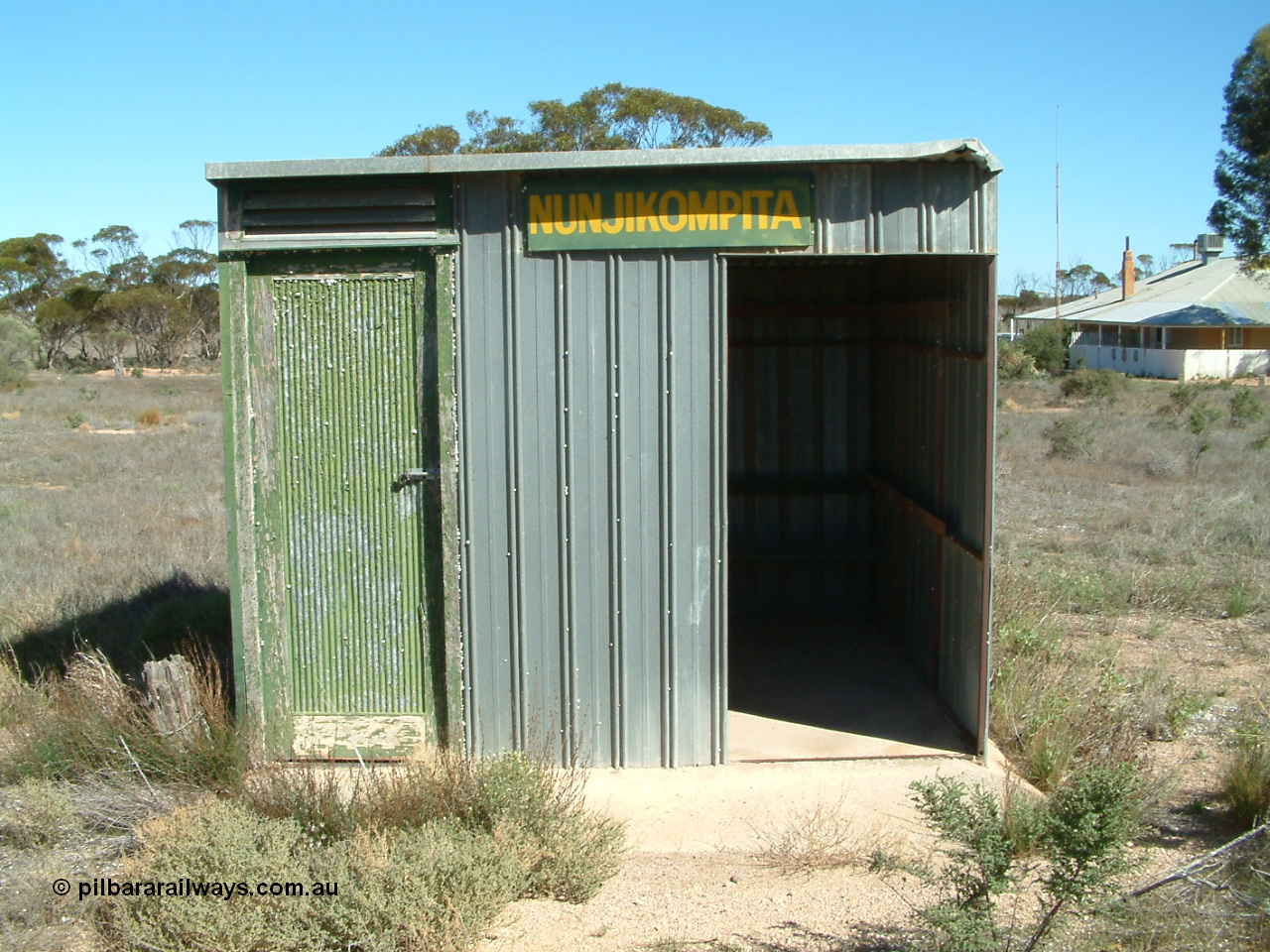 030411 141404
Nunjikompita, front view of 'station' shelter shed, the door on the left used to house the control telephone.
