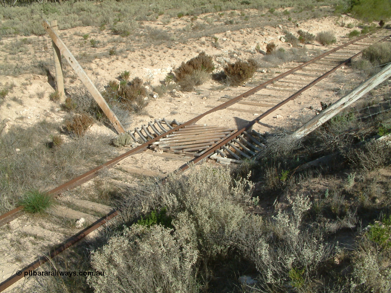 030414 155558
Penong, just east of the station precinct is this stock grid where the railway crosses a fence.
