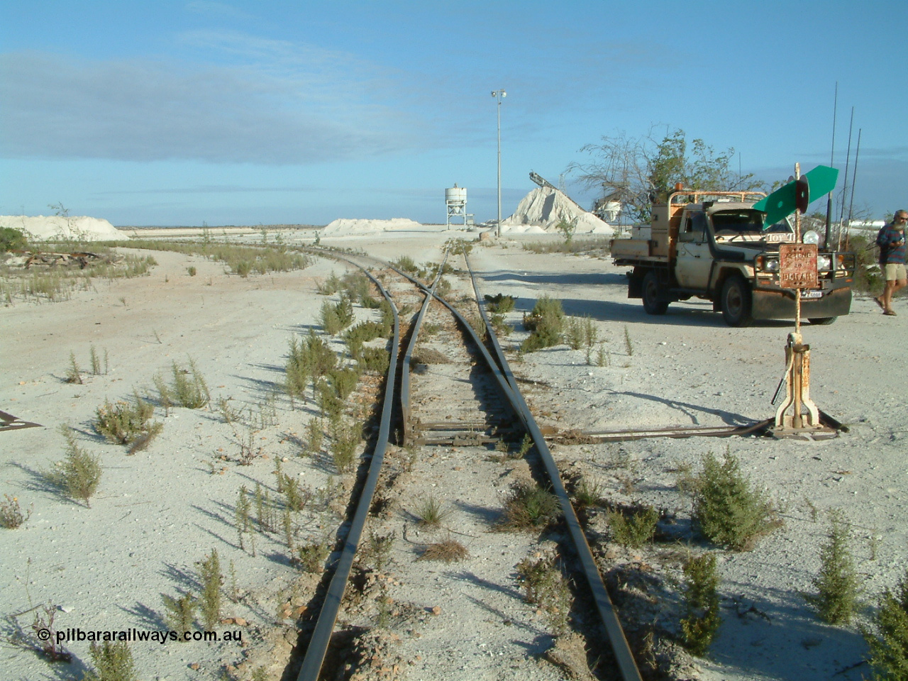 030414 163800
Kevin, , the points for the mainline to Penong Junction (Ceduna) with that line curving away to the left, straight ahead is the former gypsum loading bins.
