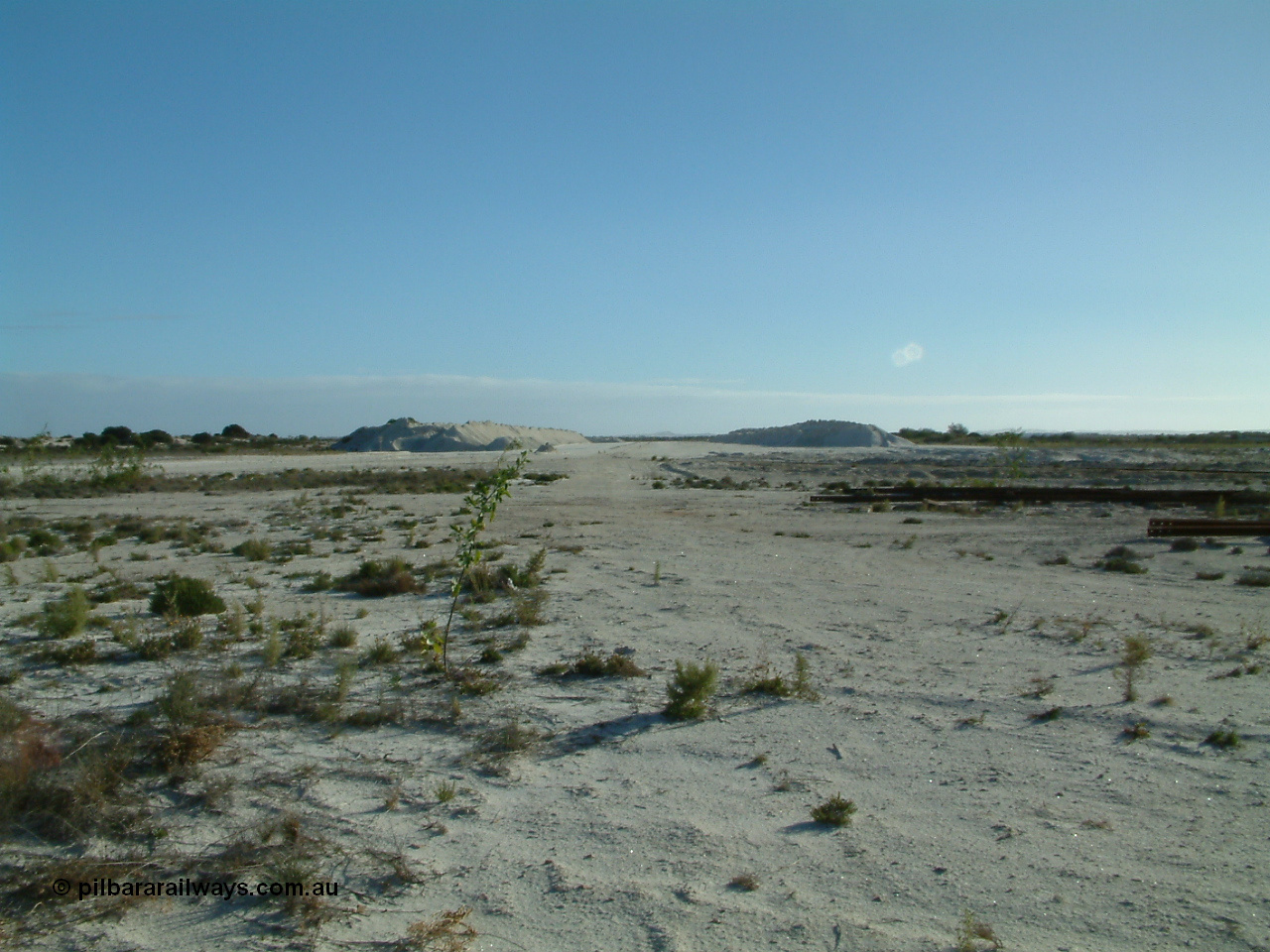030414 163840
Kevin, , view looking west from inside the triangle at the west leg with gypsum stockpiles either side.
