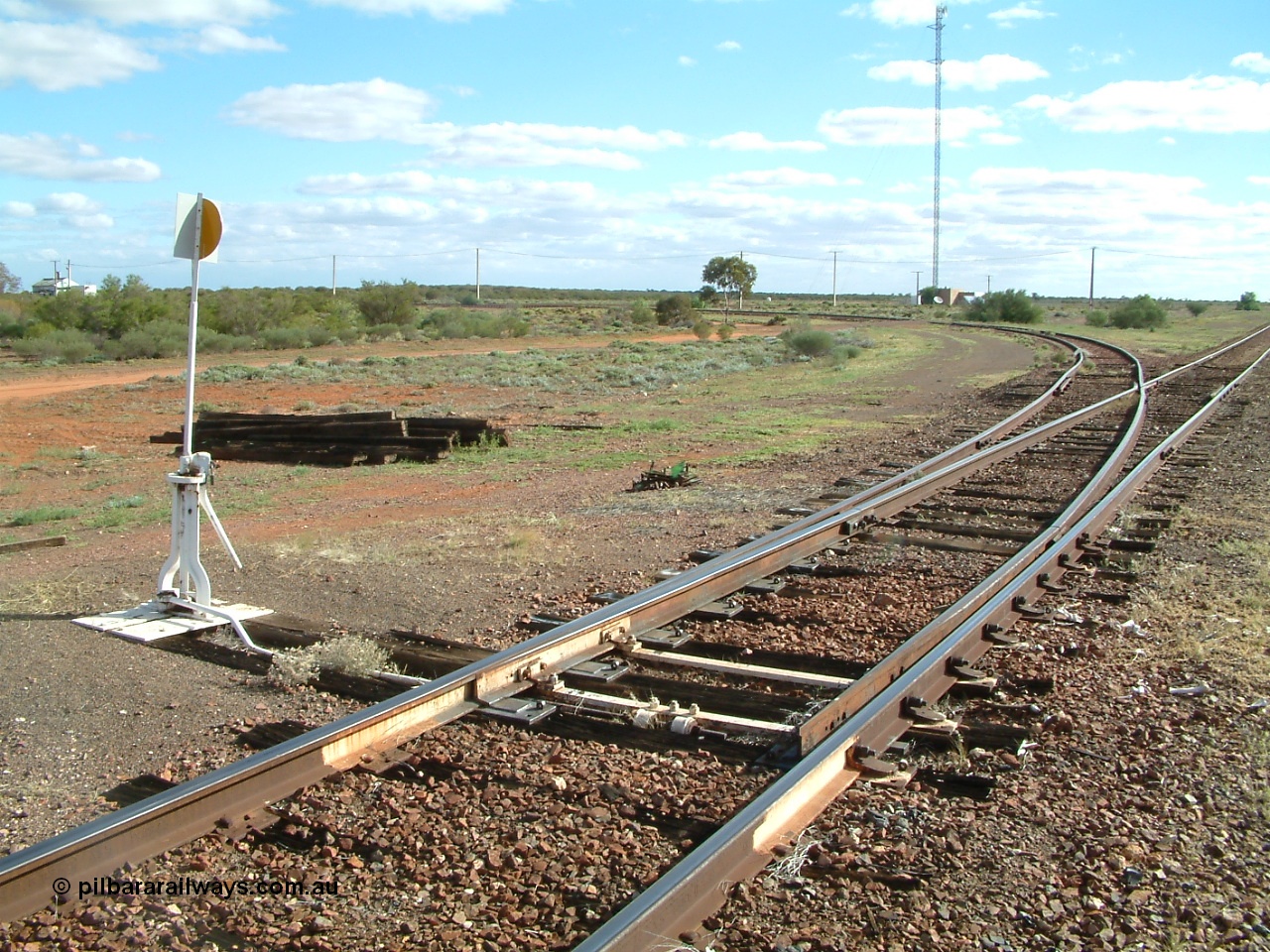 030415 154518
Tarcoola, at the 504.5 km, looking west along the eastern leg of the triangle, power station on the left, loop line running to the right. Tarcoola is the junction for the TAR and CAR railways situated 504 km from the 0 km datum at Coonamia. [url=https://goo.gl/maps/NmBNmrosE7e6d5gx8]GeoData location[/url]. 15th April 2003.
