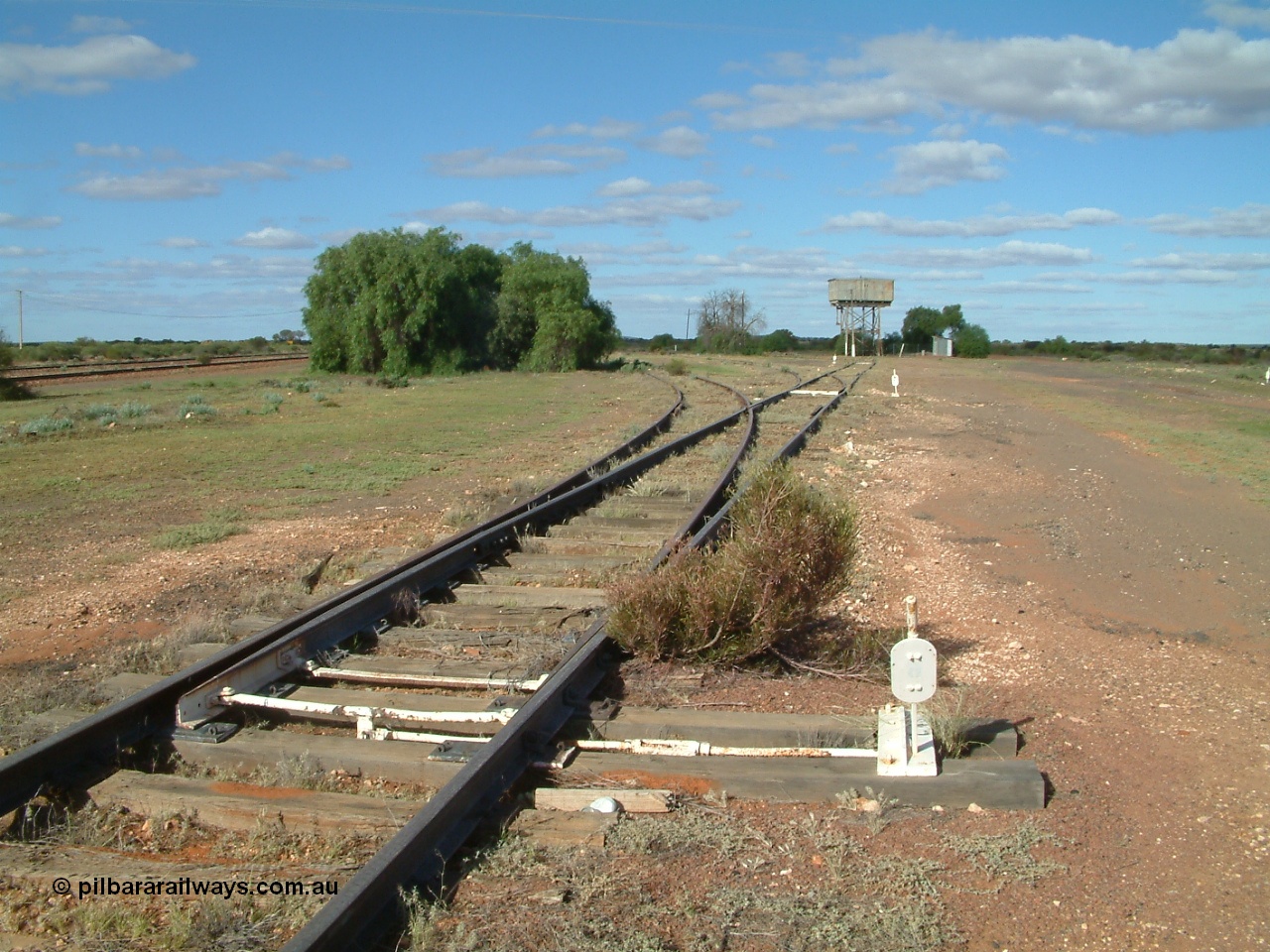 030415 154708
Tarcoola, at the 504.5 km, looking south east along the No. 1 Water Road, first set of points is the Camp Train Road, then the two Loco Roads No. 1 and No. 2. [url=https://goo.gl/maps/hBMd6tPiCPjG64URA]GeoData location[/url]. 15th April 2003.
