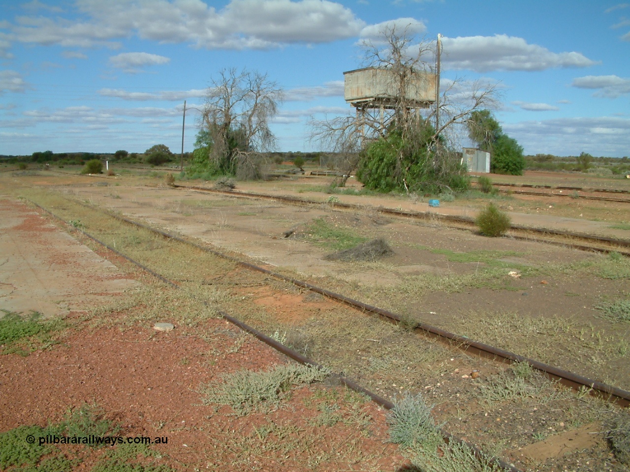 030415 154909
Tarcoola, at the 504.5 km, looking south east, roads are, Camp Train, No. 1 Loco, No. 2 Loco and No. 1 Water Road, mainline to the left. Water tank on stand. [url=https://goo.gl/maps/R5WaD6pqUgJG5abD9]GeoData location[/url]. 15th April 2003.
