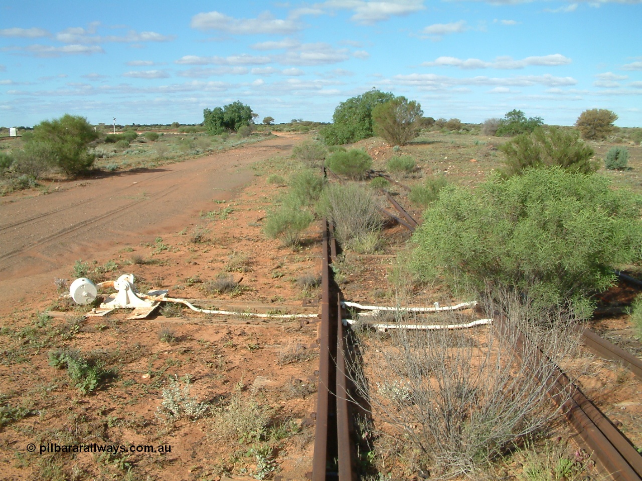 030415 155228
Tarcoola, at the 504.5 km, looking east, points for Camp Train and No. 2 Loco Roads with the No. 1 Water Road coming in from the right. Mainline to the left. [url=https://goo.gl/maps/y17pUsTYVeRwPsa67]GeoData location[/url]. 15th April 2003.
