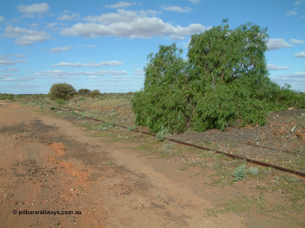 030415 155314
Tarcoola, at the 504.5 km, looking south east at the remains of the head shunt off the Camp Train and No. 1 Water Roads. [url=https://goo.gl/maps/1664sPzPxipPs6mZ6]GeoData location[/url]. 15th April 2003.
