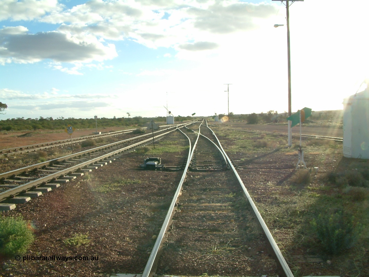 030415 172140
Tarcoola, at the 504.5 km, looking west along the Central Australian Line, Trans Australian is the middle road with the loop rejoining on the far left in the distance. Tarcoola is the junction for the TAR and CAR railways. [url=https://goo.gl/maps/Q9Zk6vaHoH2d2LTt5]GeoData location[/url]. 15th April 2003.
