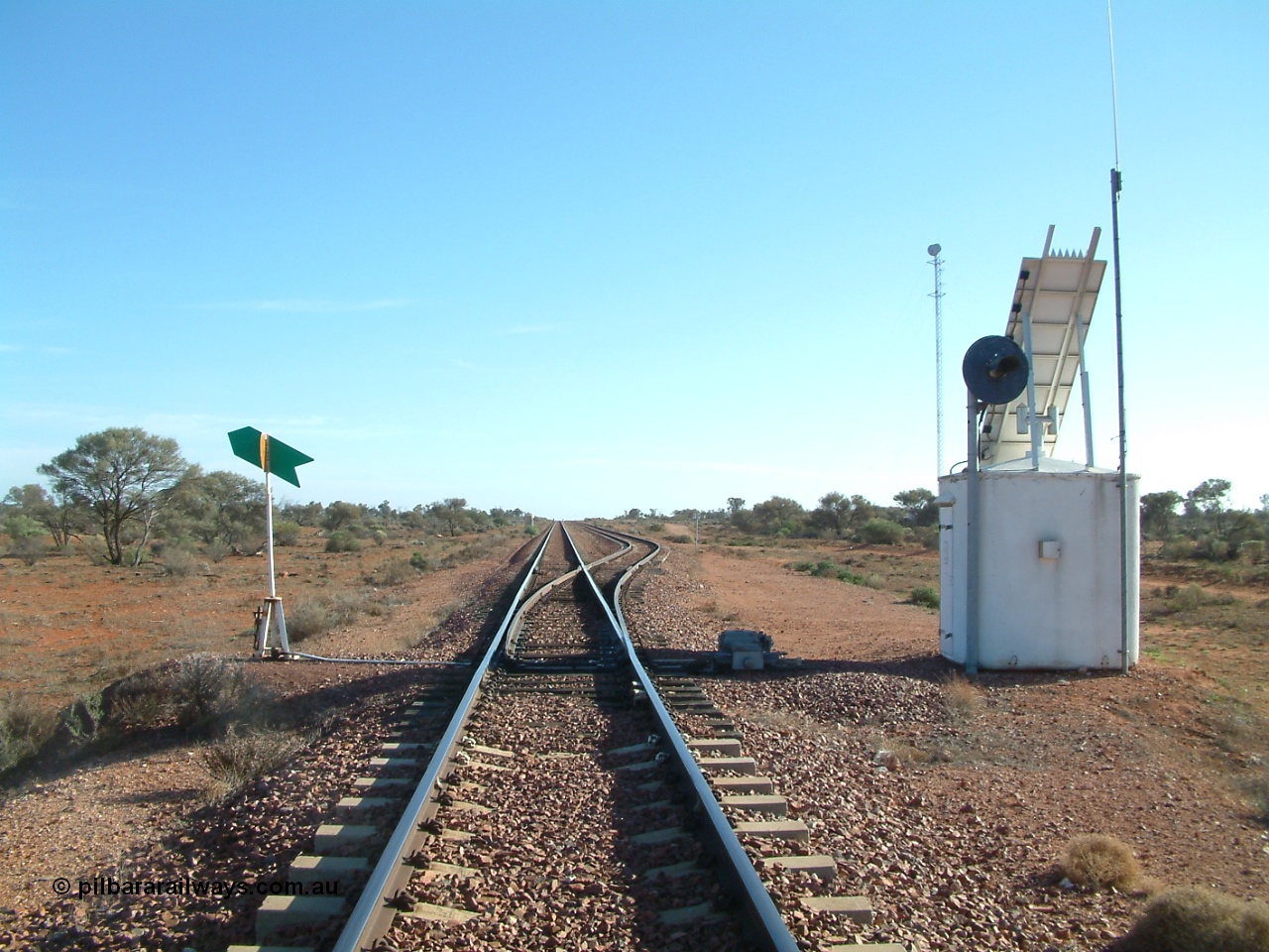 030416 083542
Carnes Siding located at the 566.4 km on the Central Australian line from Tarcoola to Alice Springs. View of the line and loop looking north from the south end with point indicator, interlocking hut and repeater signal and communications tower in the background. [url=https://goo.gl/maps/d5okP7KUhaCnCJaVA]GeoData location[/url]. 16th April 2003.
