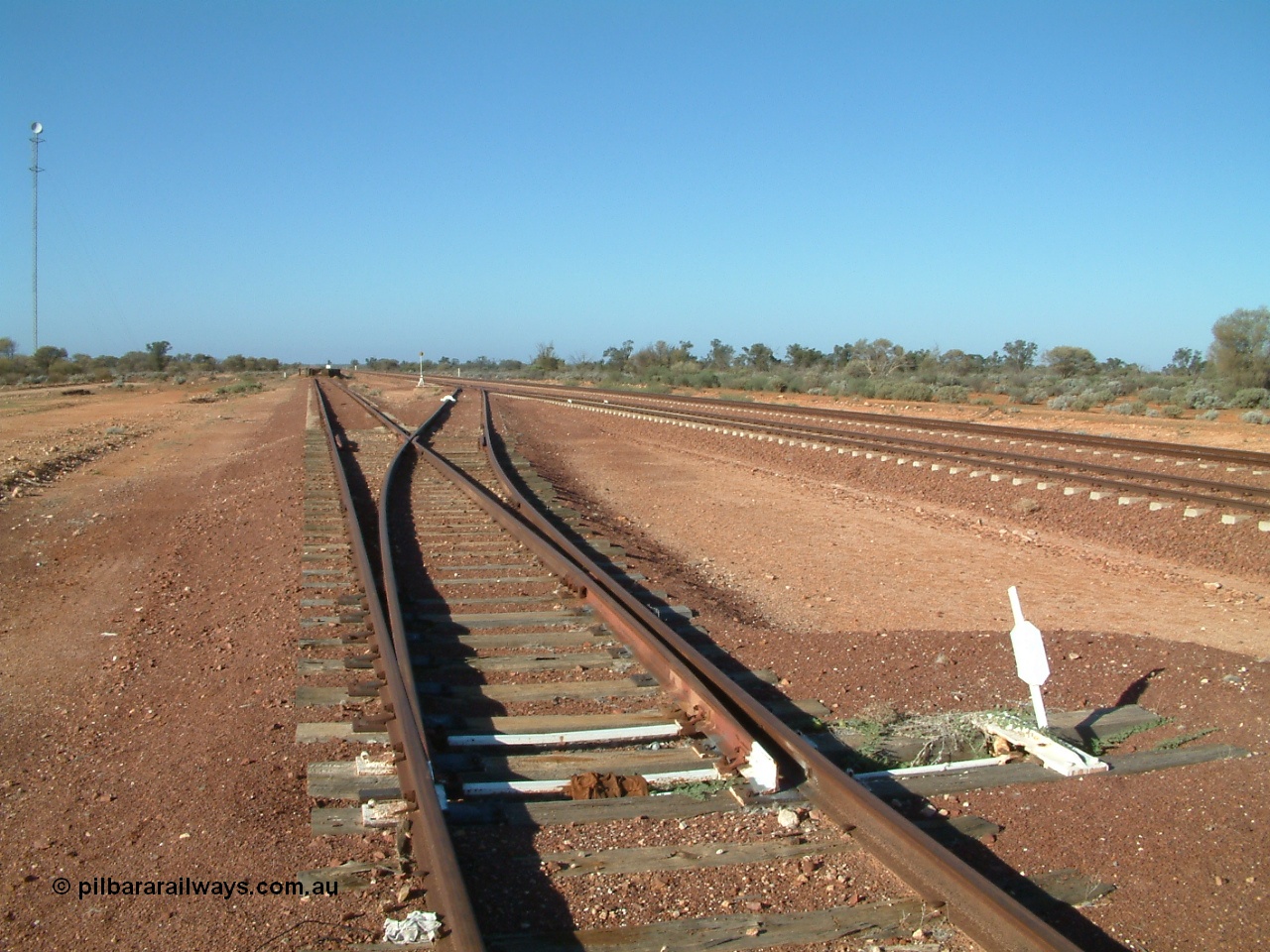 030416 083850
Carnes Siding located at the 566.4 km on the Central Australian line from Tarcoola to Alice Springs. Looking south from the goods siding off the loop with deadend siding to loading ramp, communications tower at left. [url=https://goo.gl/maps/SFbQb2qfyMiVfcXq7]GeoData location[/url]. 16th April 2003.
