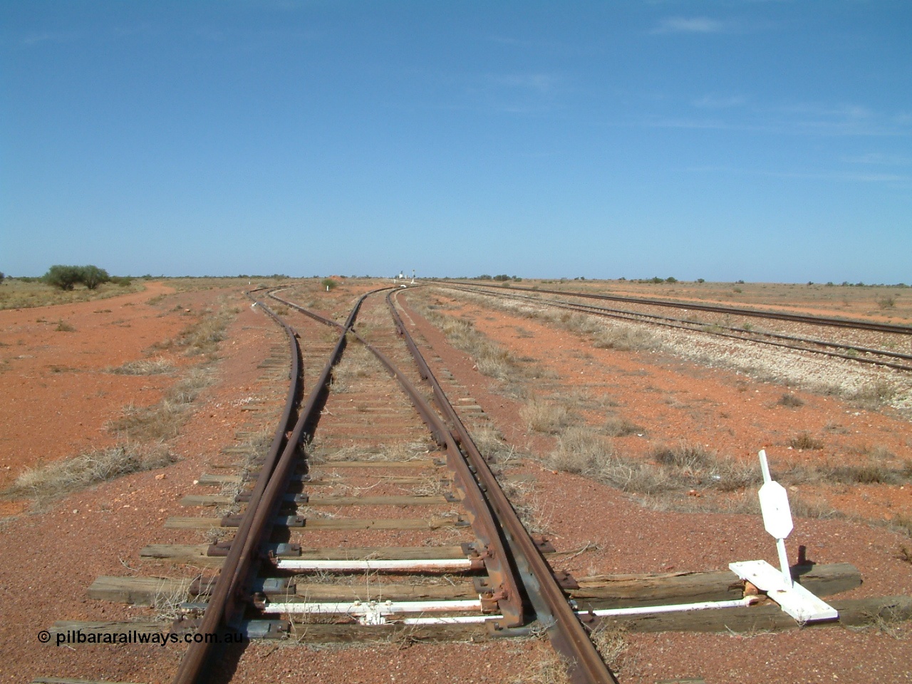 030416 105908
Manguri Siding, looking south at the end of the goods loop with a loading ramp deadend siding off to the left. Located 706.5 km from the 0 datum at Coonamia and 200 km north of Tarcoola between Wirrida and Cadney Park on the Tarcoola - Alice Springs line. [url=https://goo.gl/maps/Nohh3U8BSTposHKV9]GeoData location[/url]. 16th April 2003.
