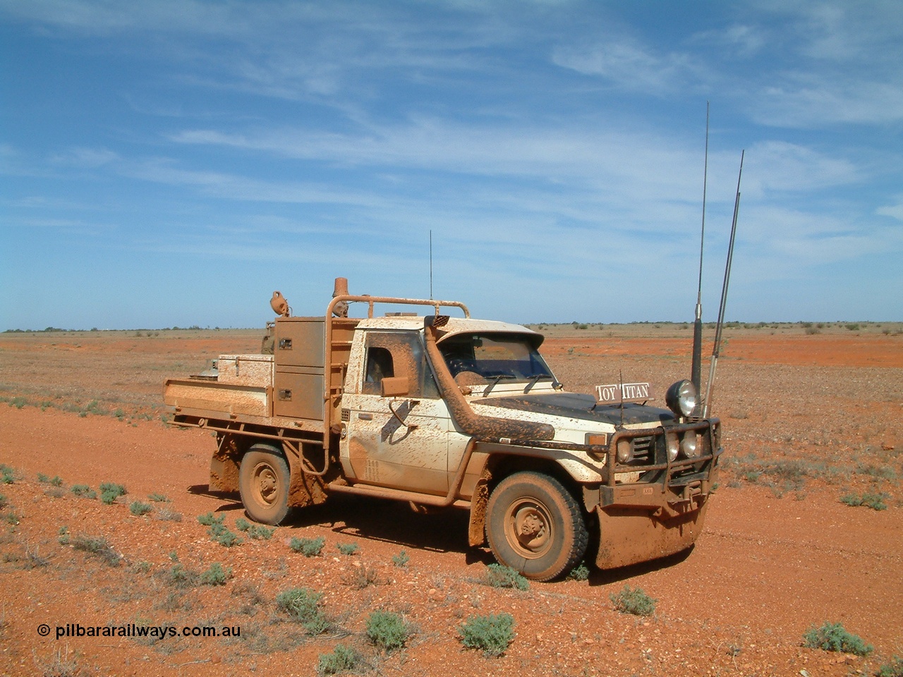 030416 110340
Here we are at a siding on the Tarcoola - Alice Springs railway line, Manguri which is 200 km north of Tarcoola and 40 km from Coober Pedy. As you can see the track was a bit wet. 16th April 2003. [url=https://goo.gl/maps/y8coKnvDBraSuT8G7]GeoData location[/url]. 16th April 2003.
