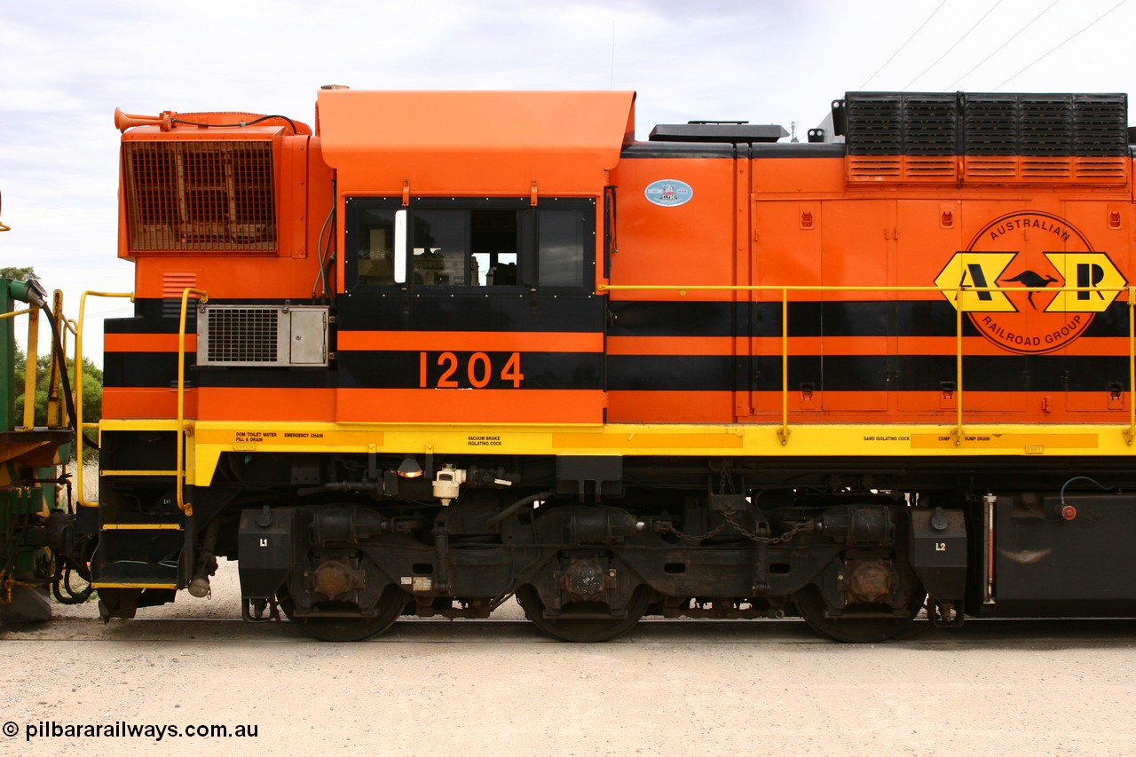 060108 2079
Lock, ARG 1200 class unit 1204, a Clyde Engineering EMD model G12C serial 65-428, final of fourteen originally built between 1960-65 for WAGR as their A class A 1514, fitted with dynamic brakes and financed by Western Mining Corporation, started on the Eyre Peninsula in August 2004.
Keywords: 1200-class;1204;Clyde-Engineering-Granville-NSW;EMD;G12C;65-428;A-class;A1514;
