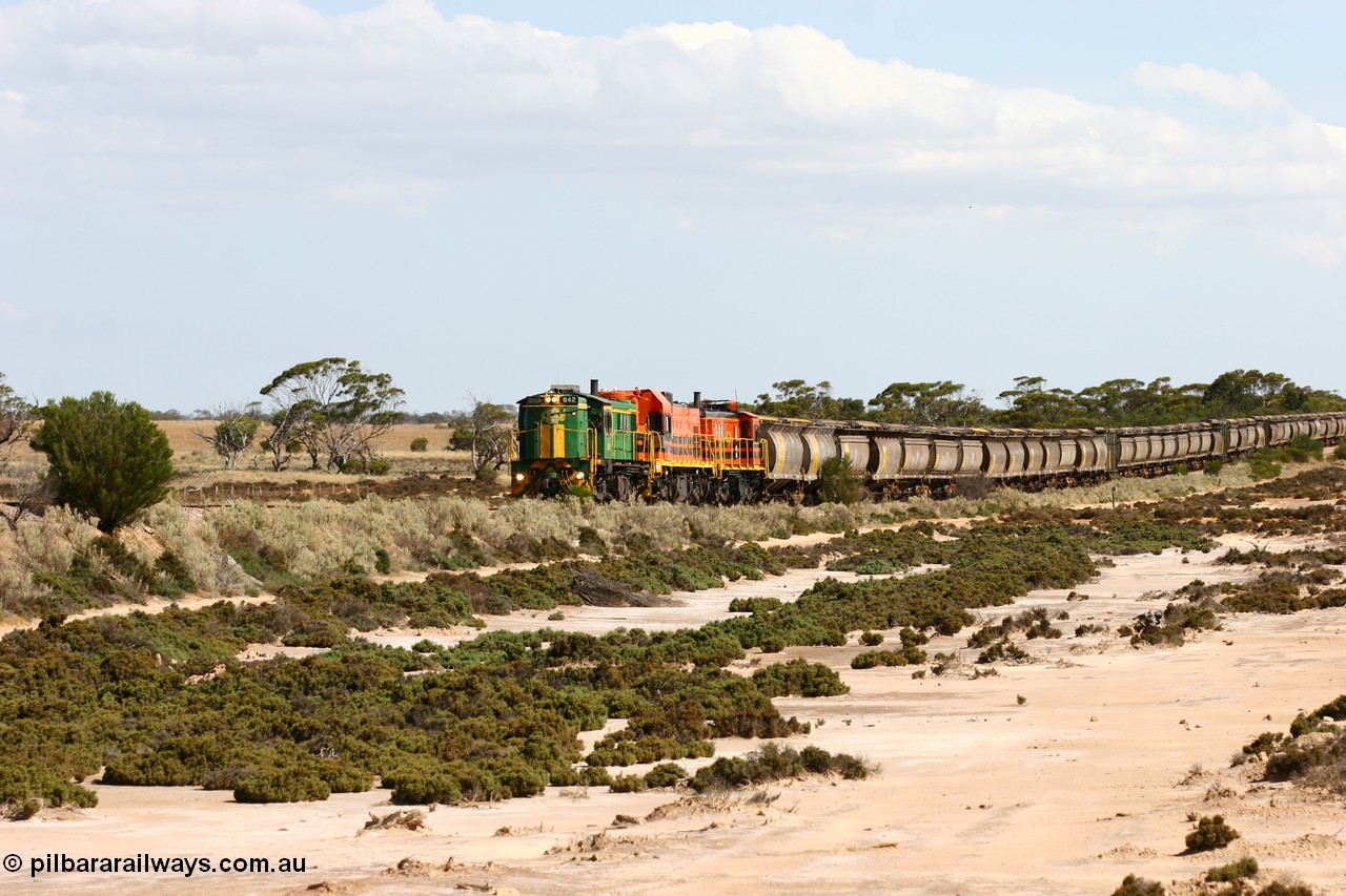 060109 2091
Kyancutta at the 198 km, ASR 830 class unit 842, an AE Goodwin built ALCo DL531 model loco serial 84140 leads EMD unit 1204 due to air-conditioning trouble and sister ALCo 851 across a dry salt soak with a north bound empty grain train. 9th January 2006.
Keywords: 830-class;842;AE-Goodwin;ALCo;DL531;84140;