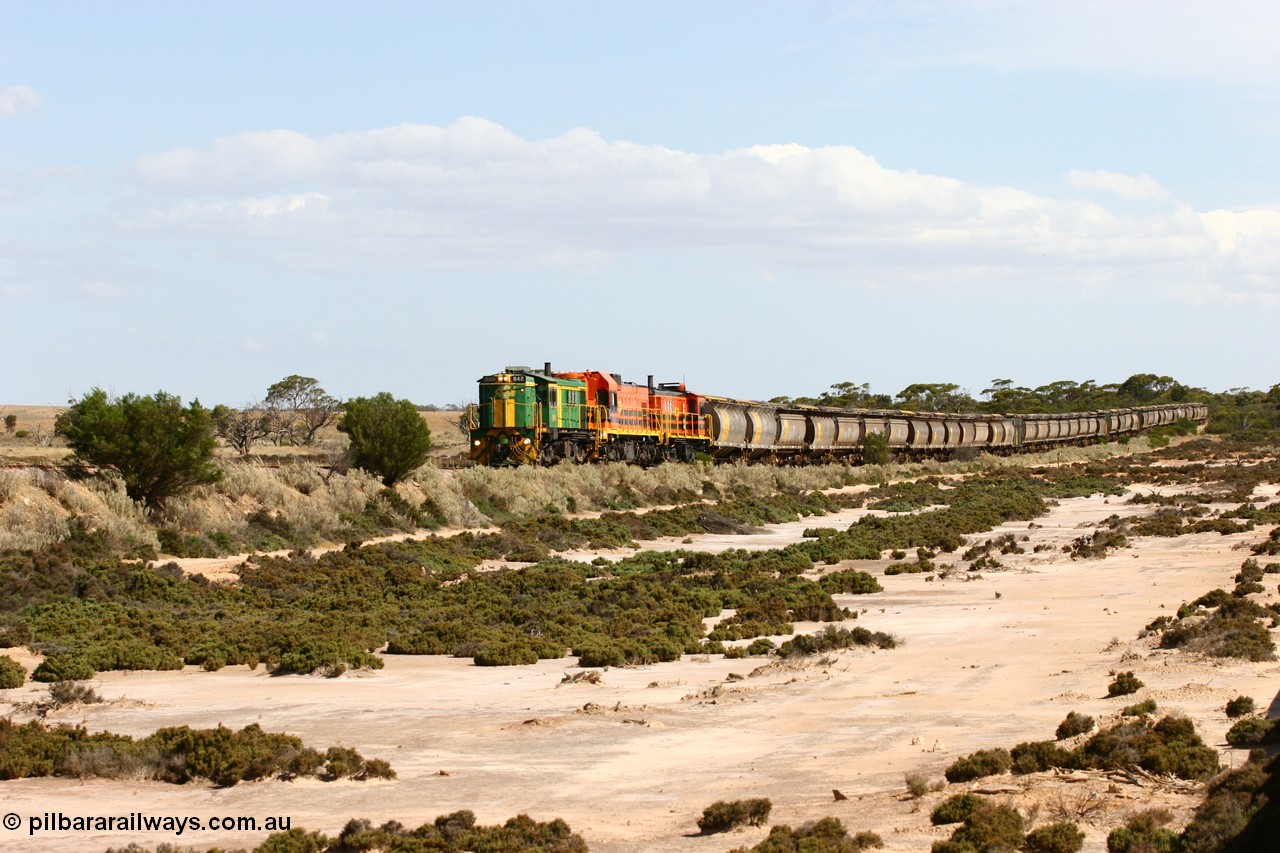 060109 2095
Kyancutta at the 198 km, ASR 830 class unit 842, an AE Goodwin built ALCo DL531 model loco serial 84140 leads EMD unit 1204 due to air-conditioning trouble and sister ALCo 851 across a dry salt soak with a north bound empty grain train. 9th January 2006.
Keywords: 830-class;842;AE-Goodwin;ALCo;DL531;84140;