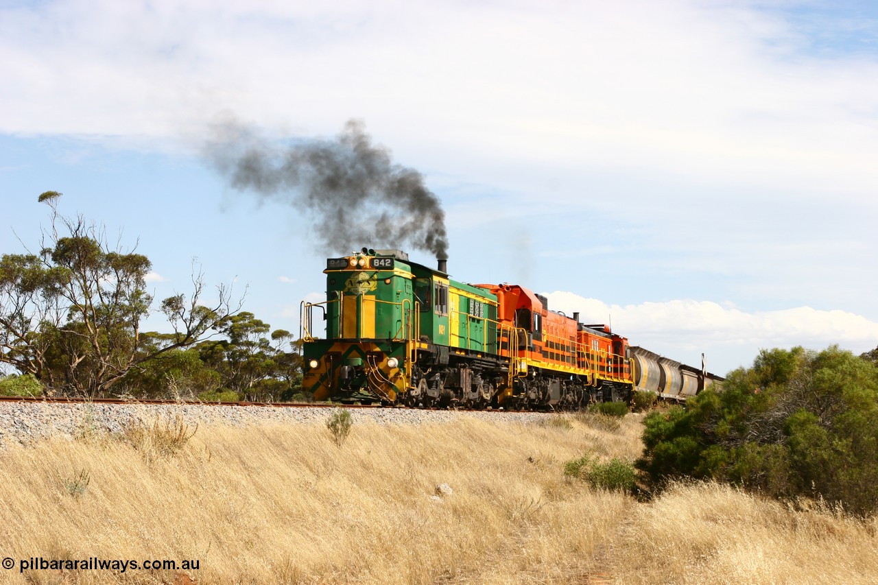 060109 2106
Kyancutta, Kyancutta Tanks Rd grade crossing, ASR 830 class unit 842, an AE Goodwin built ALCo DL531 model loco serial 84140 leads EMD unit 1204 due to air-conditioning trouble and sister ALCo 851 lift the empty north bound grain train away from crew change. 9th January 2006.
Keywords: 830-class;842;AE-Goodwin;ALCo;DL531;84140;