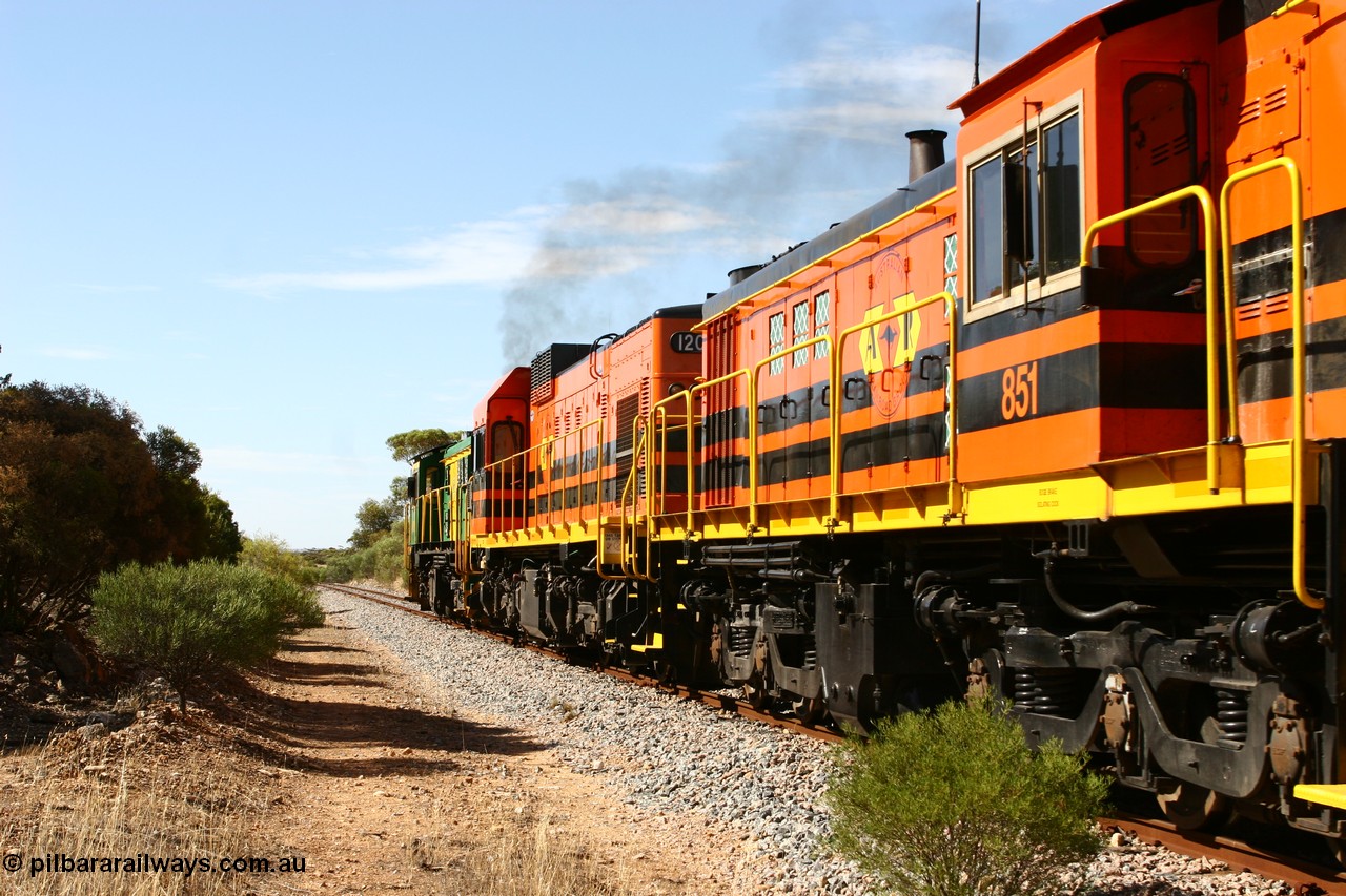 060109 2109
Kyancutta, Kyancutta Tanks Rd grade crossing, ASR 830 class unit 842, an AE Goodwin built ALCo DL531 model loco serial 84140 leads EMD unit 1204 due to air-conditioning trouble and sister ALCo 851 lift the empty north bound grain train away from crew change. 9th January 2006.

