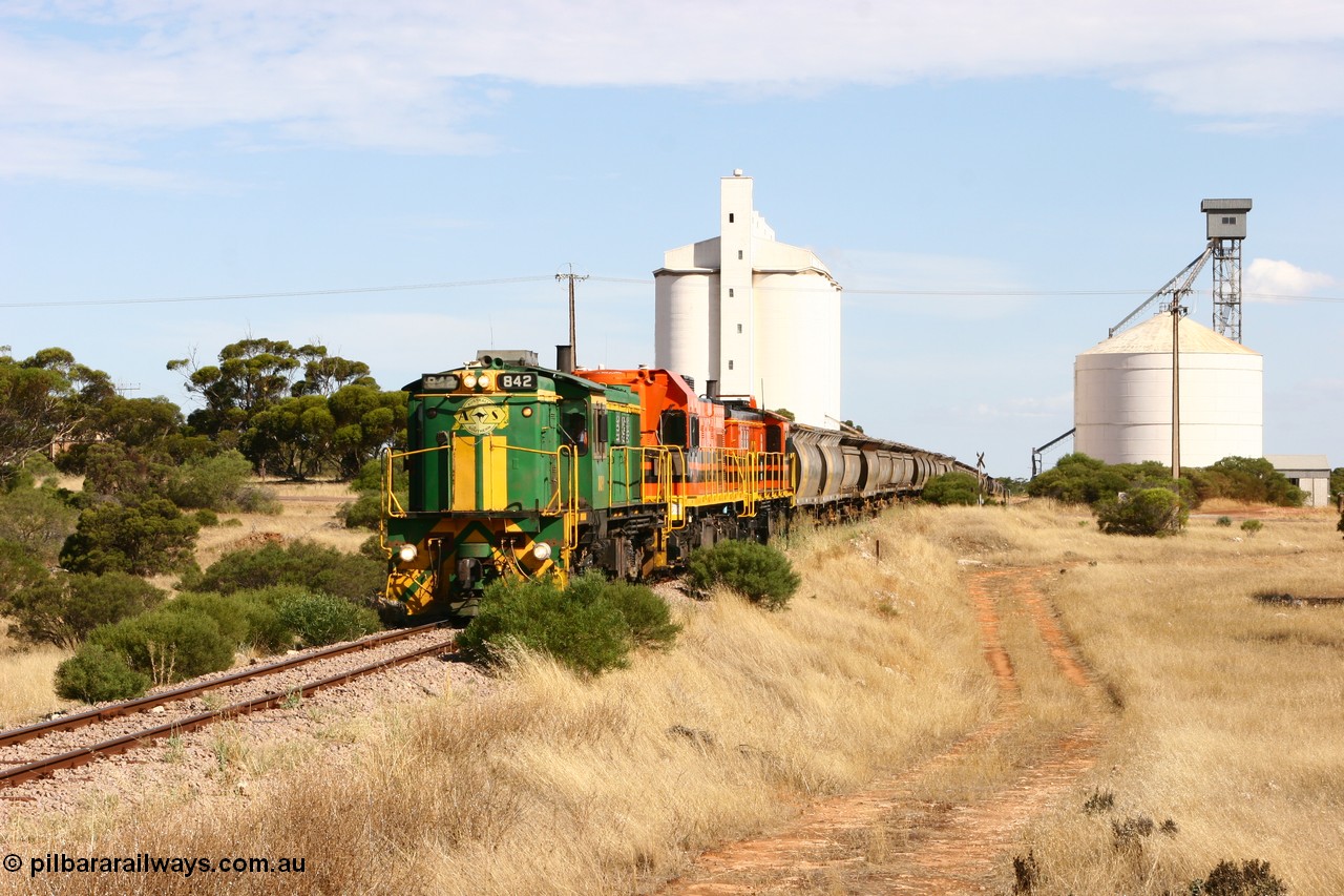 060109 2113
Kyancutta, ASR 830 class unit 842, an AE Goodwin built ALCo DL531 model loco serial 84140 leads EMD unit 1204 due to air-conditioning trouble and sister ALCo 851 as they shunt across Museum Terrace to place empty grain waggons on the silo loop. 9th January 2006.
Keywords: 830-class;842;AE-Goodwin;ALCo;DL531;84140;