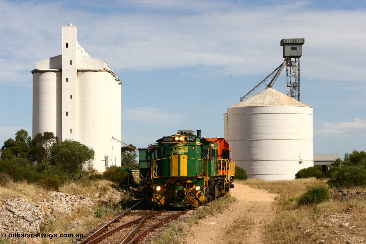 060109 2121
Kyancutta, ASR 830 class unit 842, an AE Goodwin built ALCo DL531 model loco serial 84140 leads EMD unit 1204 due to air-conditioning trouble and sister ALCo 851 as they shunt empty grain waggons on the silo loop. 9th January 2006.
Keywords: 830-class;842;AE-Goodwin;ALCo;DL531;84140;